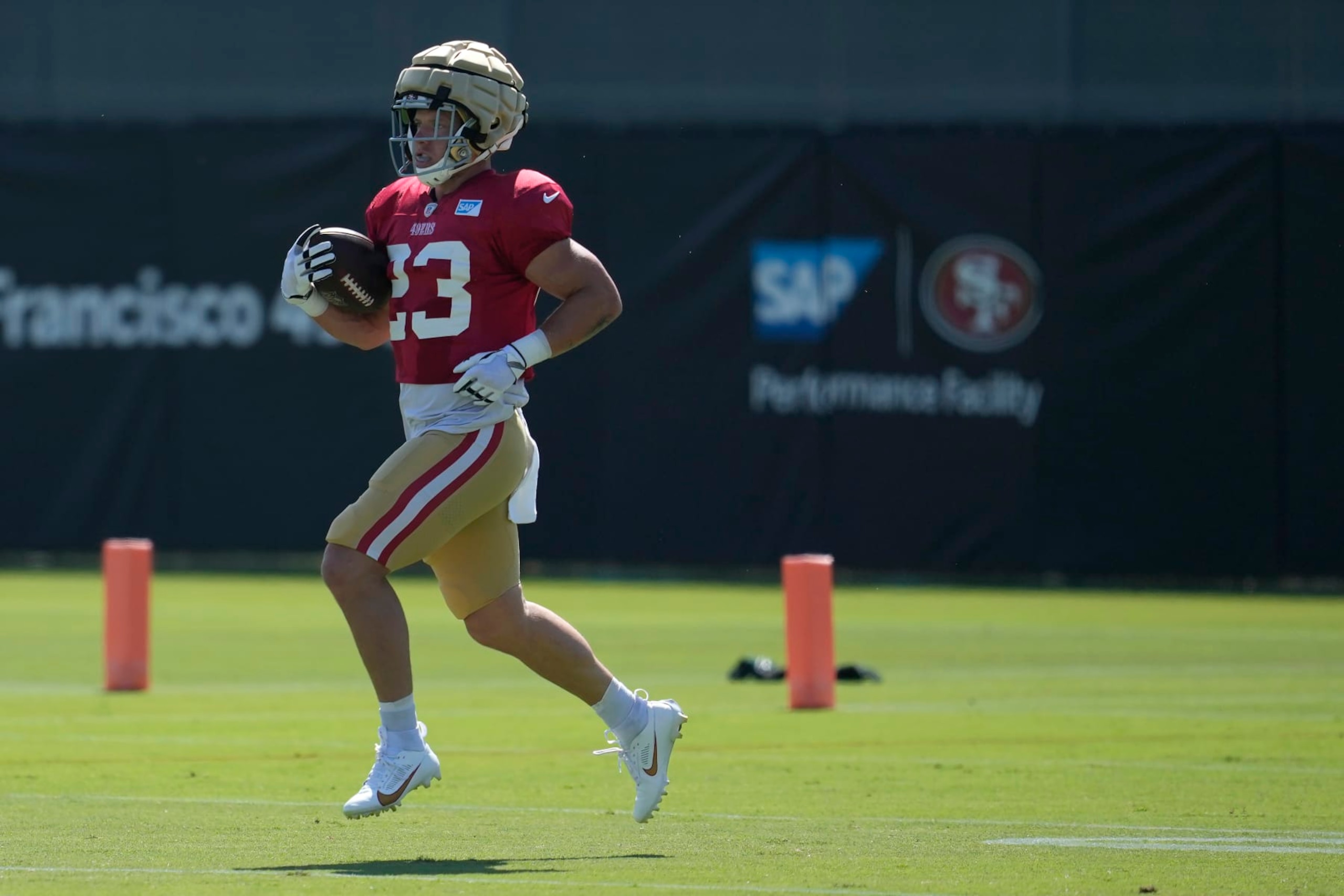 San Francisco 49ers running back Christian McCaffrey (23) takes part in drills during the NFL team's football training camp in Santa Clara, Calif., Tuesday, Aug. 1, 2023. (AP Photo/Jeff Chiu)