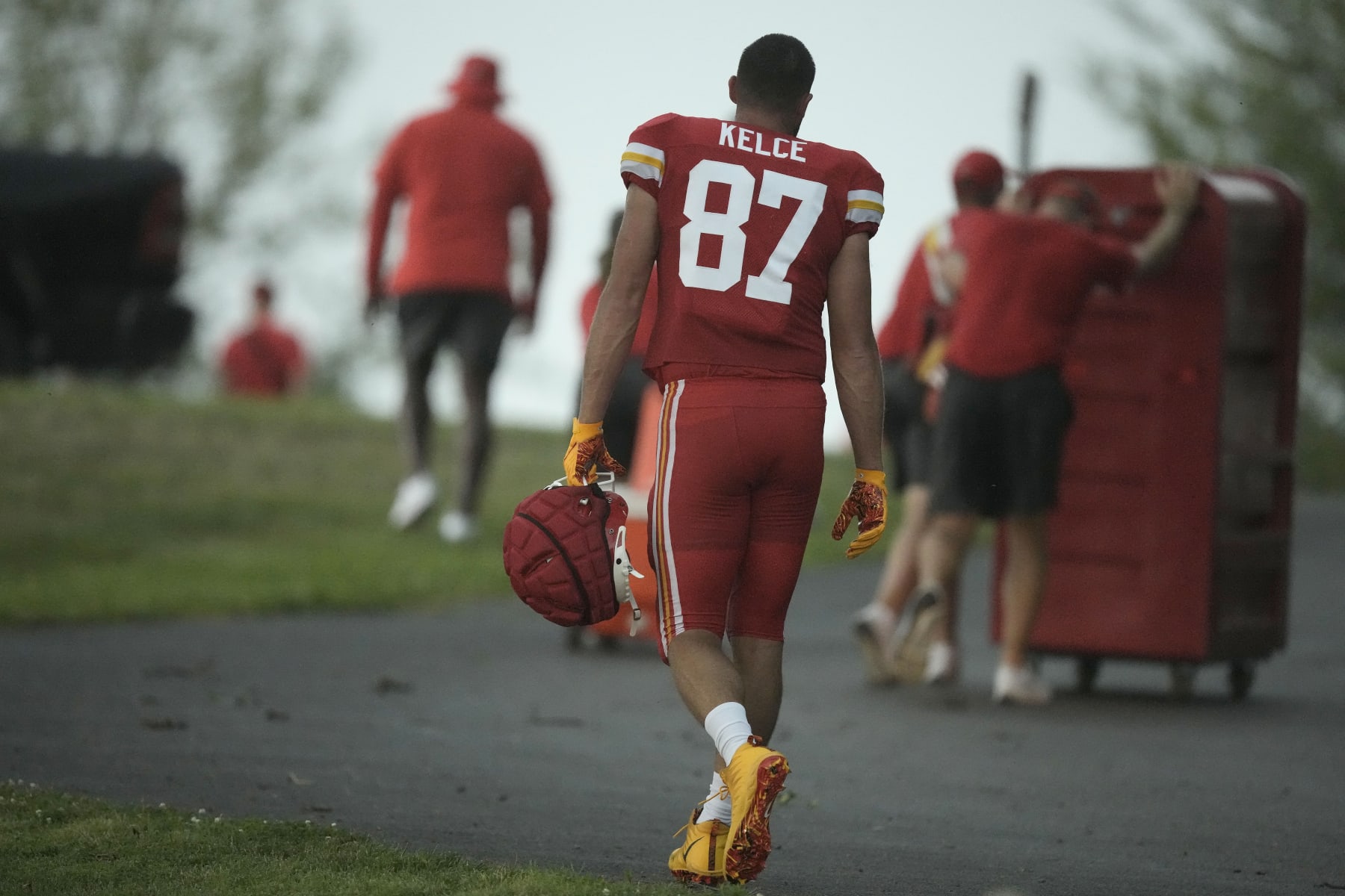 Kansas City Chiefs tight end Travis Kelce heads to shelter after NFL football training camp was cancelled when a severe thunderstorm moved through Saturday, July 29, 2023, in St. Joseph, Mo. (AP Photo/Charlie Riedel) Kansas City Chiefs tight end Travis Kelce heads to shelter after NFL football training camp was cancelled when a severe thunderstorm moved through Saturday, July 29, 2023, in St. Joseph, Mo. (AP Photo/Charlie Riedel)