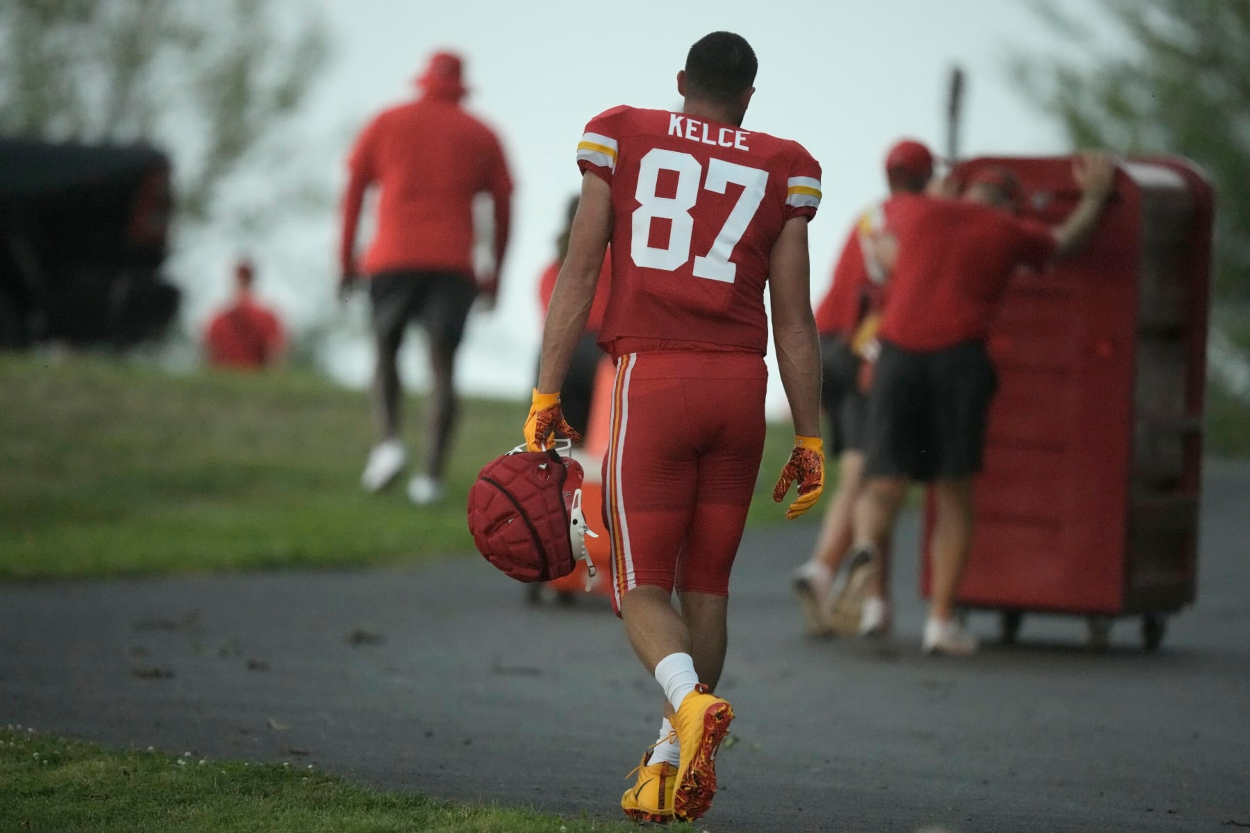 Kansas City Chiefs tight end Travis Kelce heads to shelter after NFL football training camp was cancelled when a severe thunderstorm moved through Saturday, July 29, 2023, in St. Joseph, Mo. (AP Photo/Charlie Riedel)