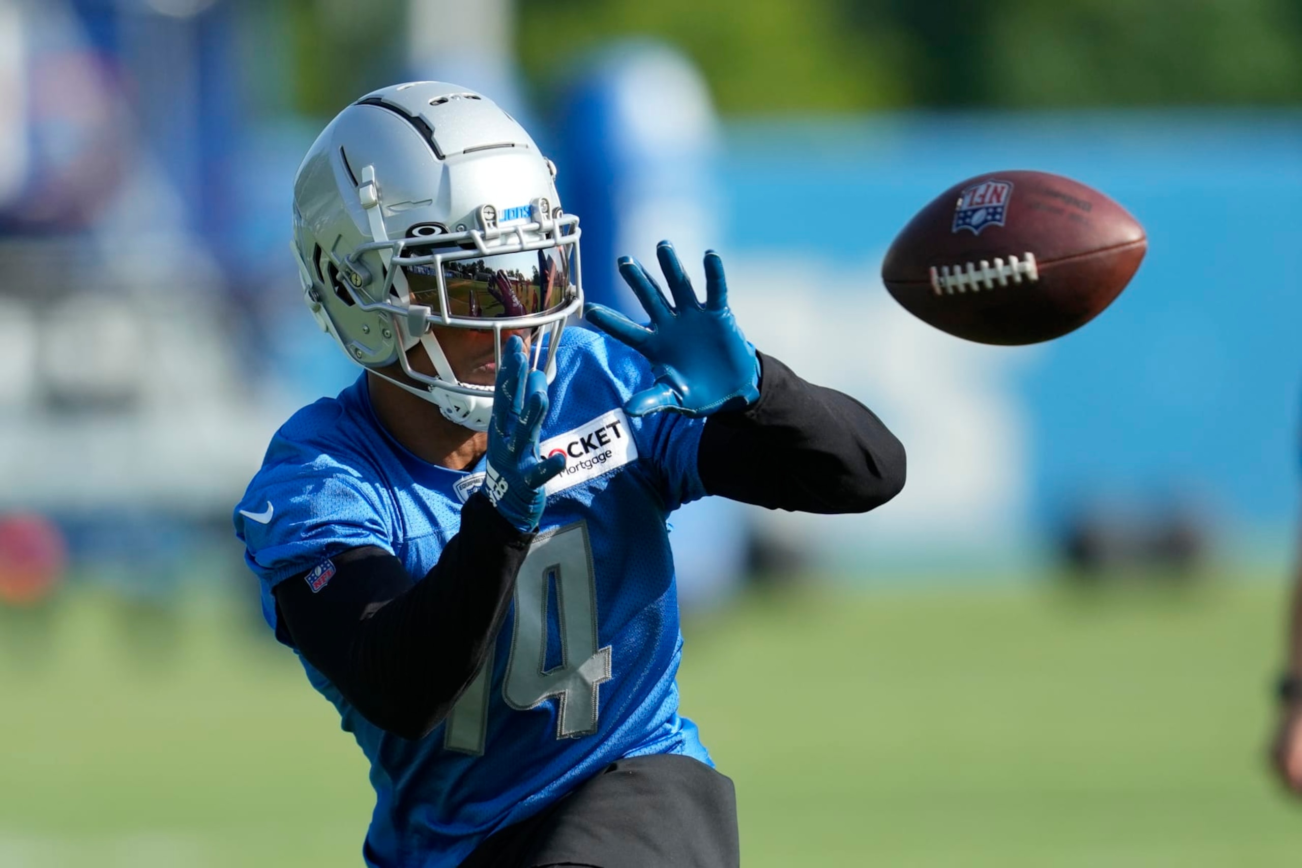 Detroit Lions wide receiver Amon-Ra St. Brown (14) catches a pass during an NFL football practice in Allen Park, Mich., Monday, July 24, 2023. (AP Photo/Paul Sancya) Detroit Lions wide receiver Amon-Ra St. Brown (14) catches a pass during an NFL football practice in Allen Park, Mich., Monday, July 24, 2023. (AP Photo/Paul Sancya)