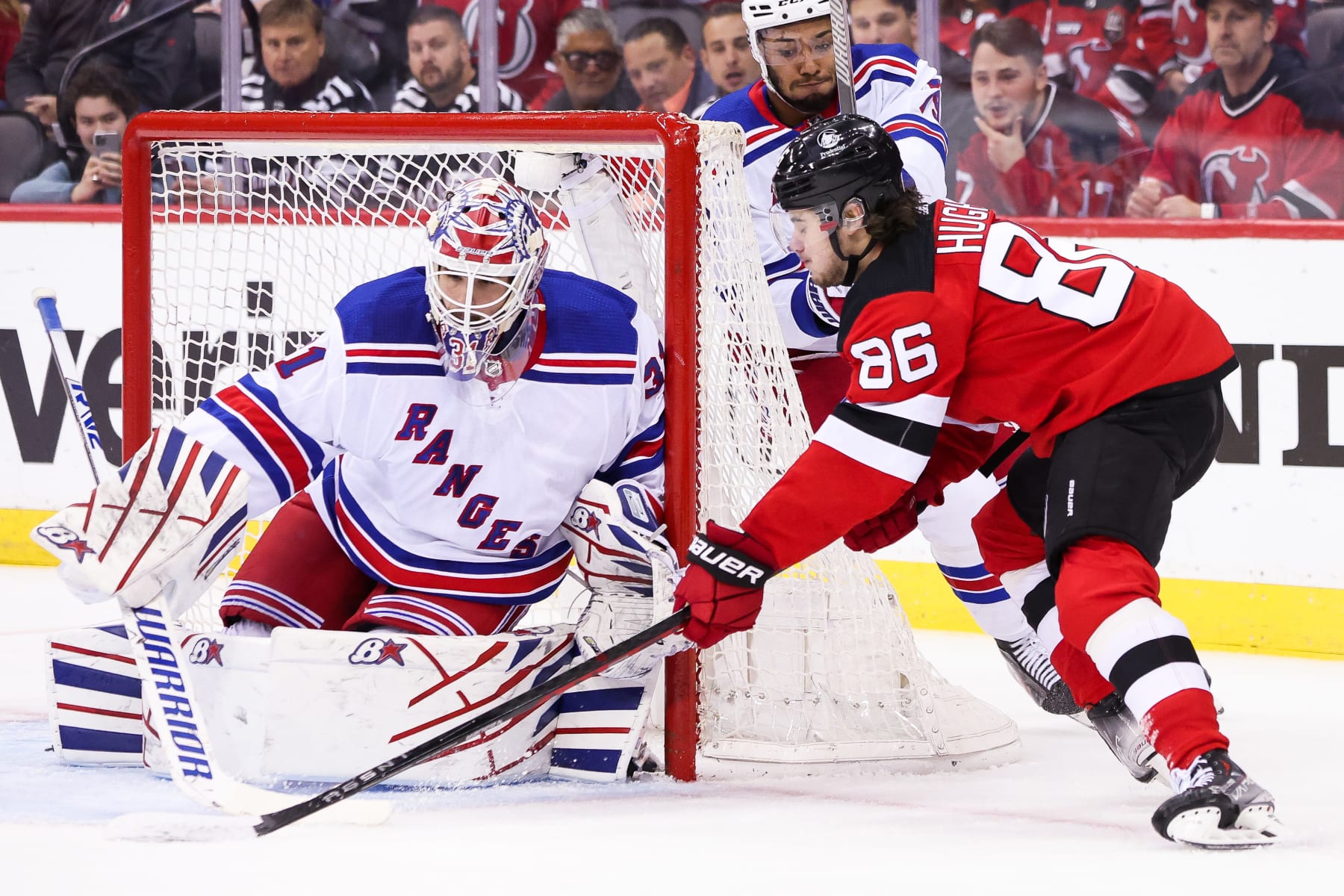 NEWARK, NJ - MAY 01: New York Rangers goaltender Igor Shesterkin (31) stops a shot from New Jersey Devils center Jack Hughes (86) during Game 7 of an Eastern Conference First Round playoff game between the New York Rangers and the New Jersey Devils on May 1, 2023, at Prudential Center in Newark, New Jersey. (Photo by Andrew Mordzynski/Icon Sportswire via Getty Images)