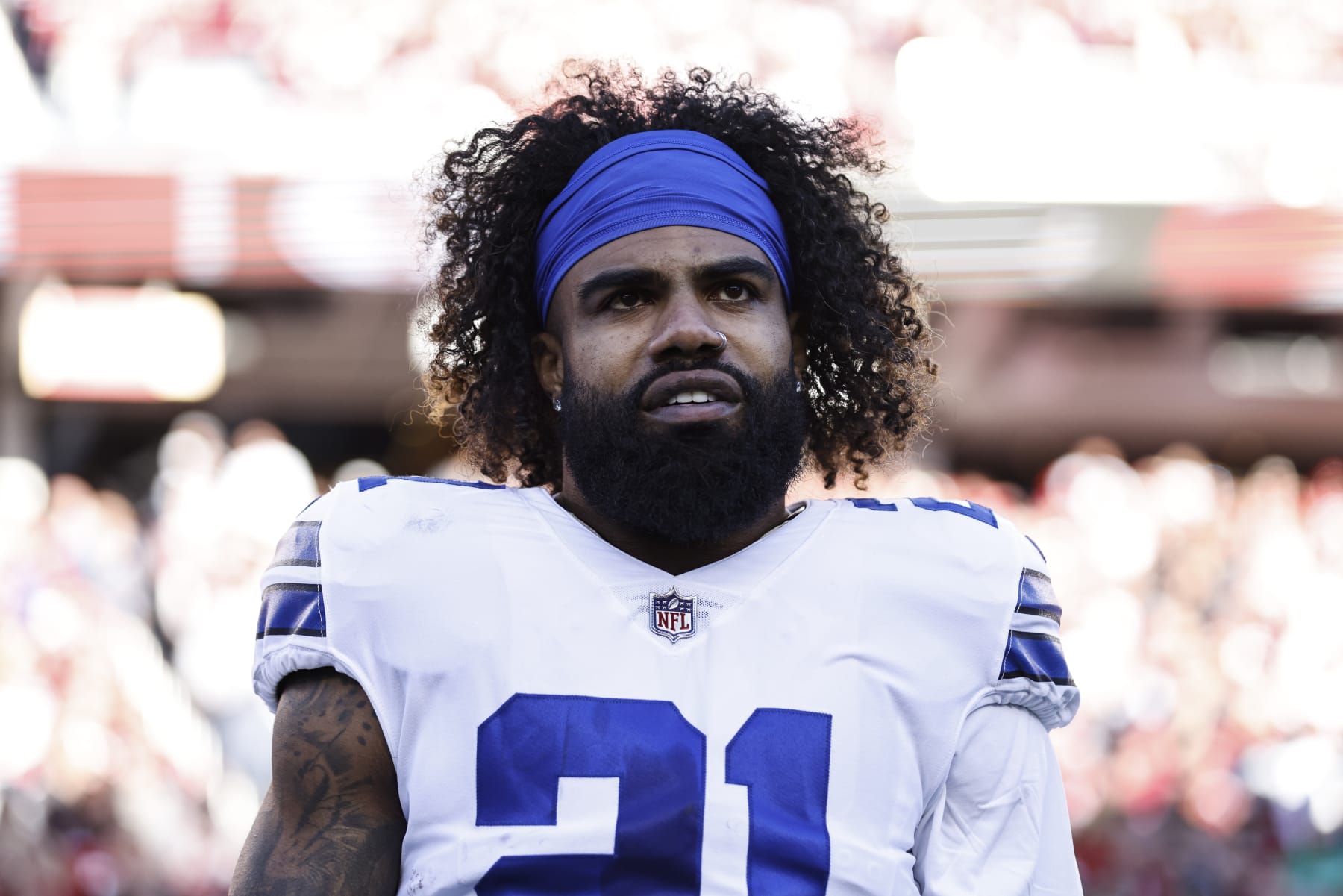 SANTA CLARA, CALIFORNIA - JANUARY 22: Ezekiel Elliott #21 of the Dallas Cowboys looks on during the national anthem prior to an NFL divisional round playoff football game between the San Francisco 49ers and the Dallas Cowboys at Levi's Stadium on January 22, 2023 in Santa Clara, California. (Photo by Michael Owens/Getty Images)