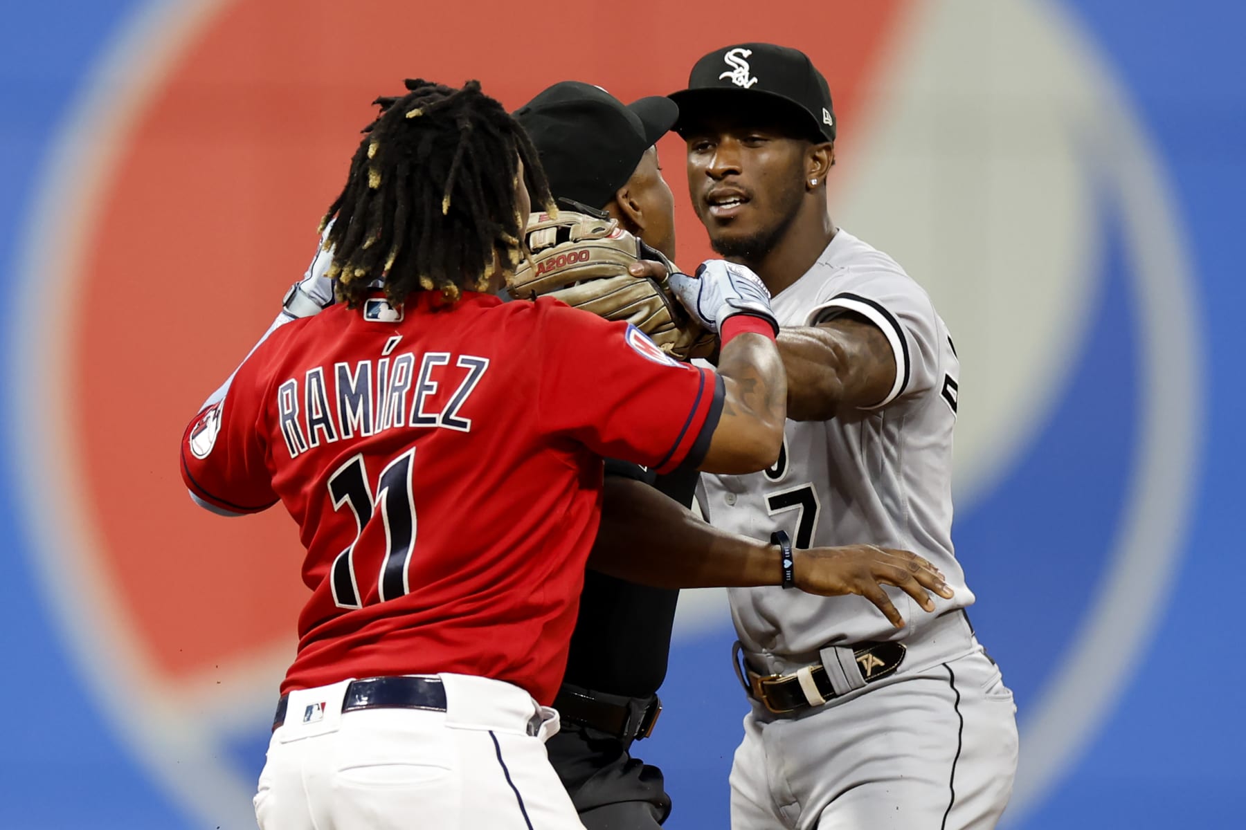 CLEVELAND, OH - AUGUST 05: Jose Ramirez #11 of the Cleveland Guardians and Tim Anderson #7 of the Chicago White Sox start to fight as umpire Malachi Moore #44 gets between them during the sixth inning at Progressive Field on August 05, 2023 in Cleveland, Ohio. (Photo by Ron Schwane/Getty Images)