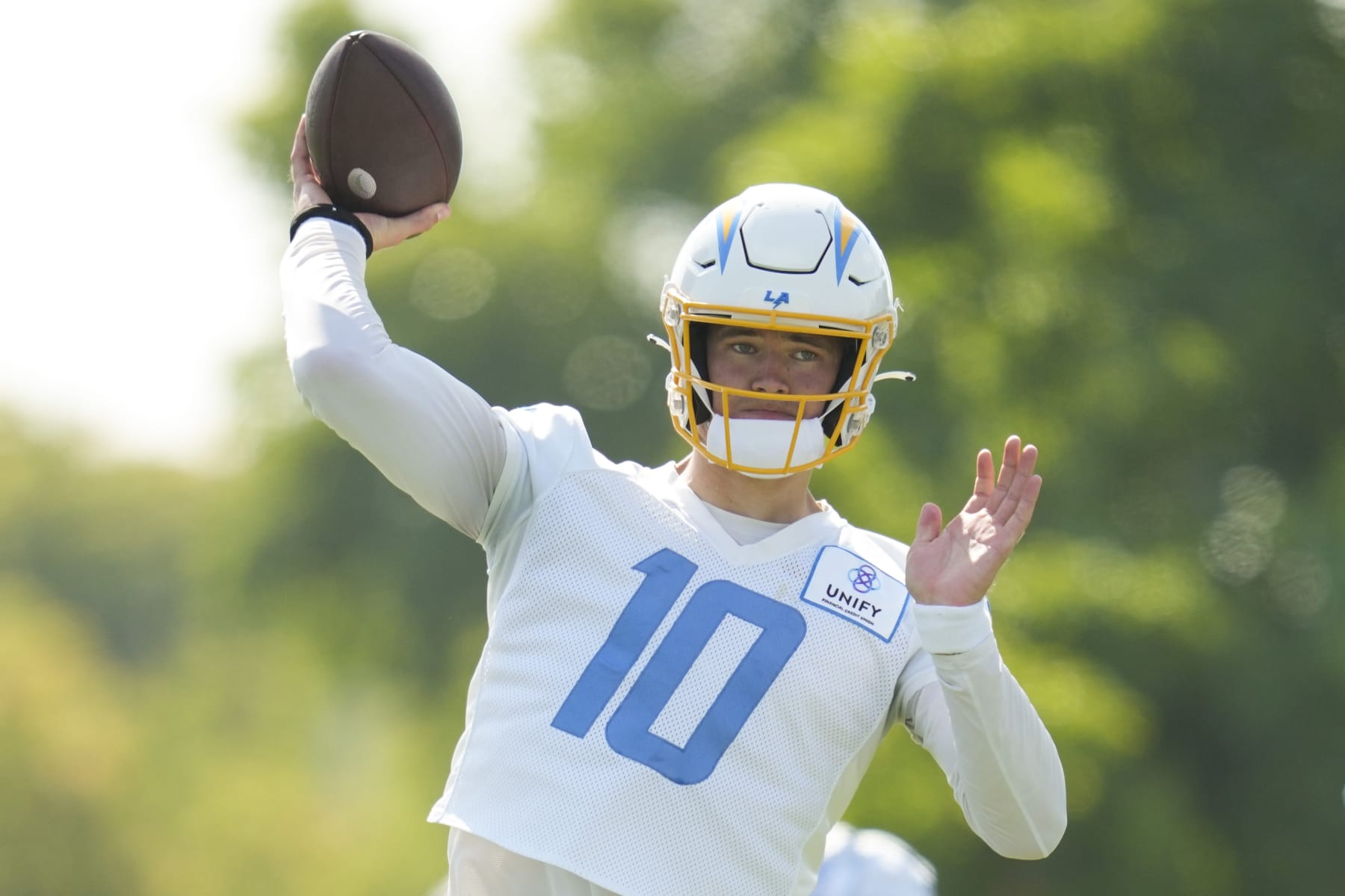 Los Angeles Chargers quarterback Justin Herbert (10) participates in a drill during the NFL football team's training camp, Saturday, July 29, 2023, in Costa Mesa, Calif. (AP Photo/Ashley Landis)