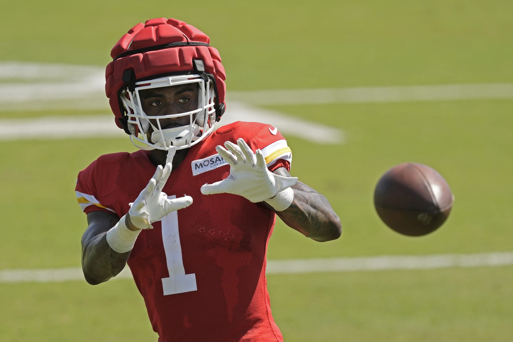 Kansas City Chiefs running back Jerick McKinnon catches a ball during NFL football training camp Friday, July 28, 2023, in St. Joseph, Mo. (AP Photo/Charlie Riedel)