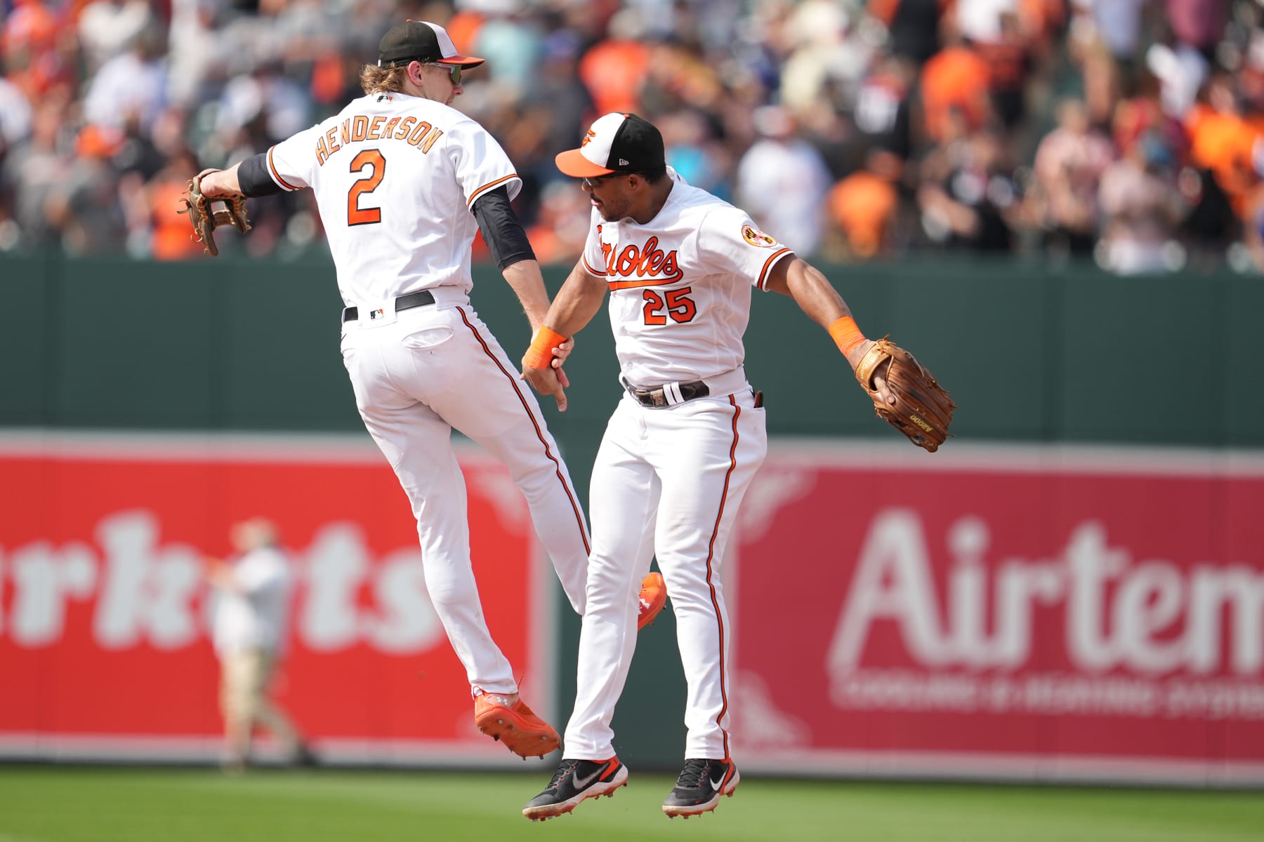 BALTIMORE, MD - AUGUST 06:  Gunnar Henderson #2 and Anthony Santander #25 of the Baltimore Orioles Celebes a win after during a baseball game at Oriole Park at Camden Yards on August 6, 2023 in Baltimore, Maryland.  (Photo by Mitchell Layton/Getty Images)