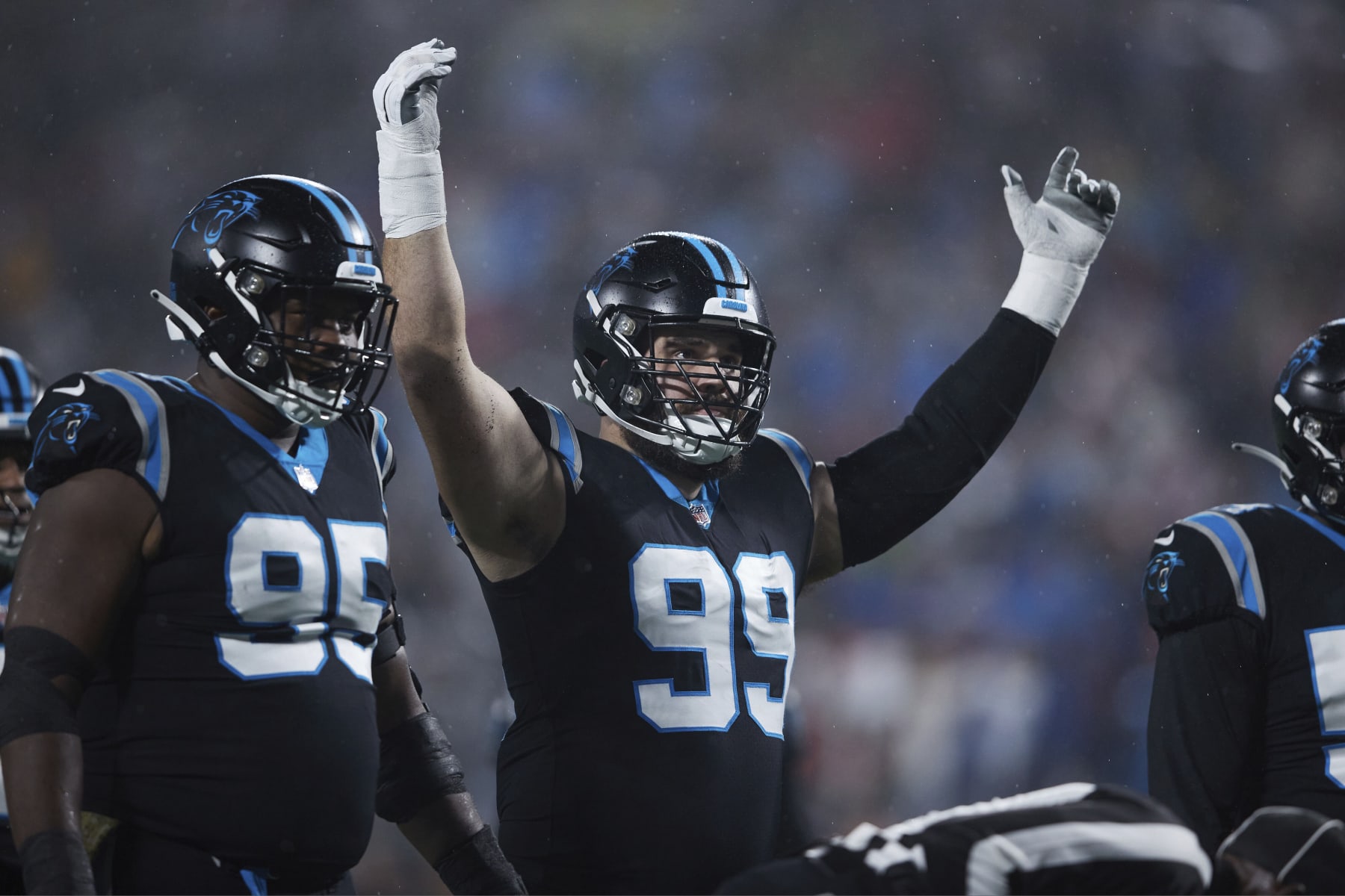Carolina Panthers defensive tackle Matt Ioannidis (99) encourages the crowd to get loud during an NFL football game against the Atlanta Falcons, Thursday, Nov. 10 2022, in Charlotte, N.C. (AP Photo/Brian Westerholt)