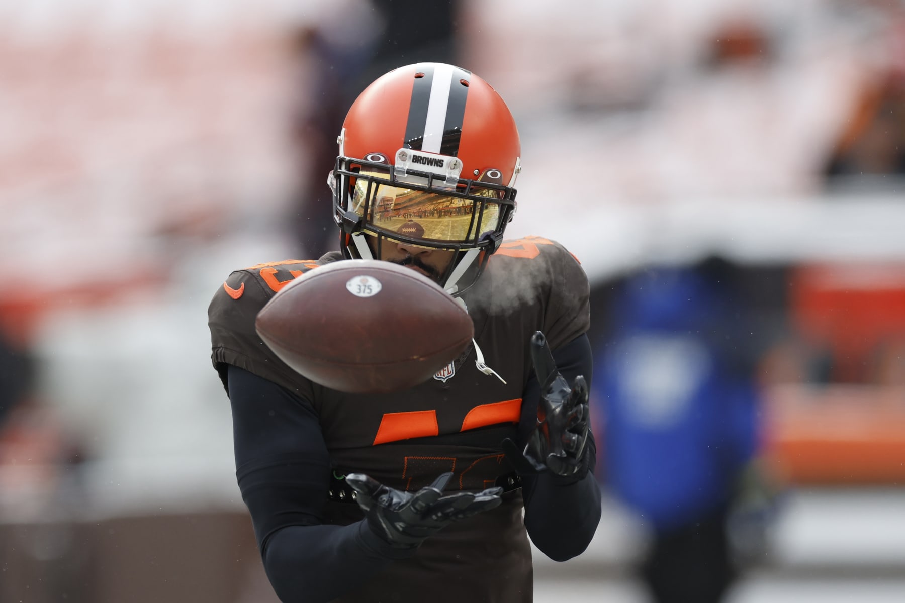 Cleveland Browns safety John Johnson III catches during pregame of an NFL football game against the New Orleans Saints, Saturday, Dec. 24, 2022, in Cleveland. (AP Photo/Ron Schwane)