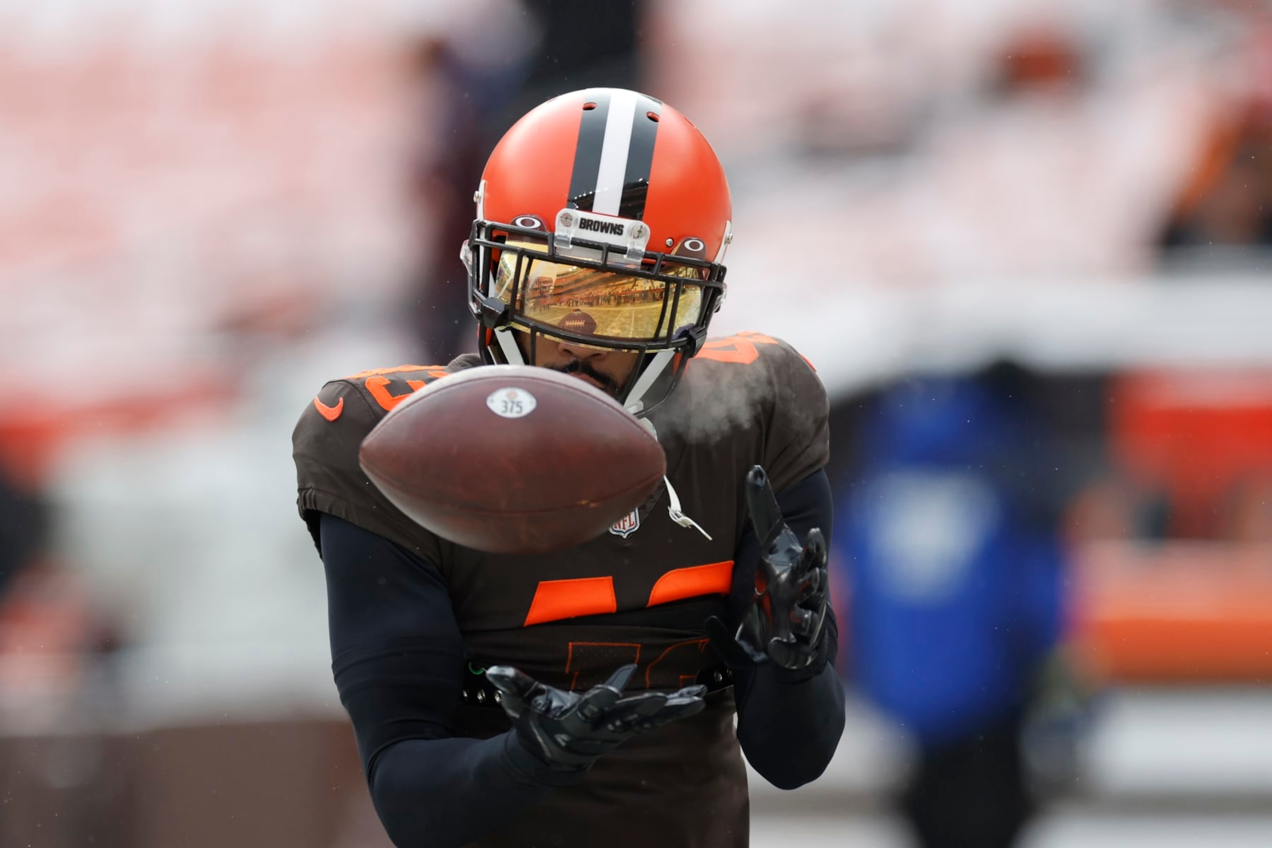 Cleveland Browns safety John Johnson III catches during pregame of an NFL football game against the New Orleans Saints, Saturday, Dec. 24, 2022, in Cleveland. (AP Photo/Ron Schwane)