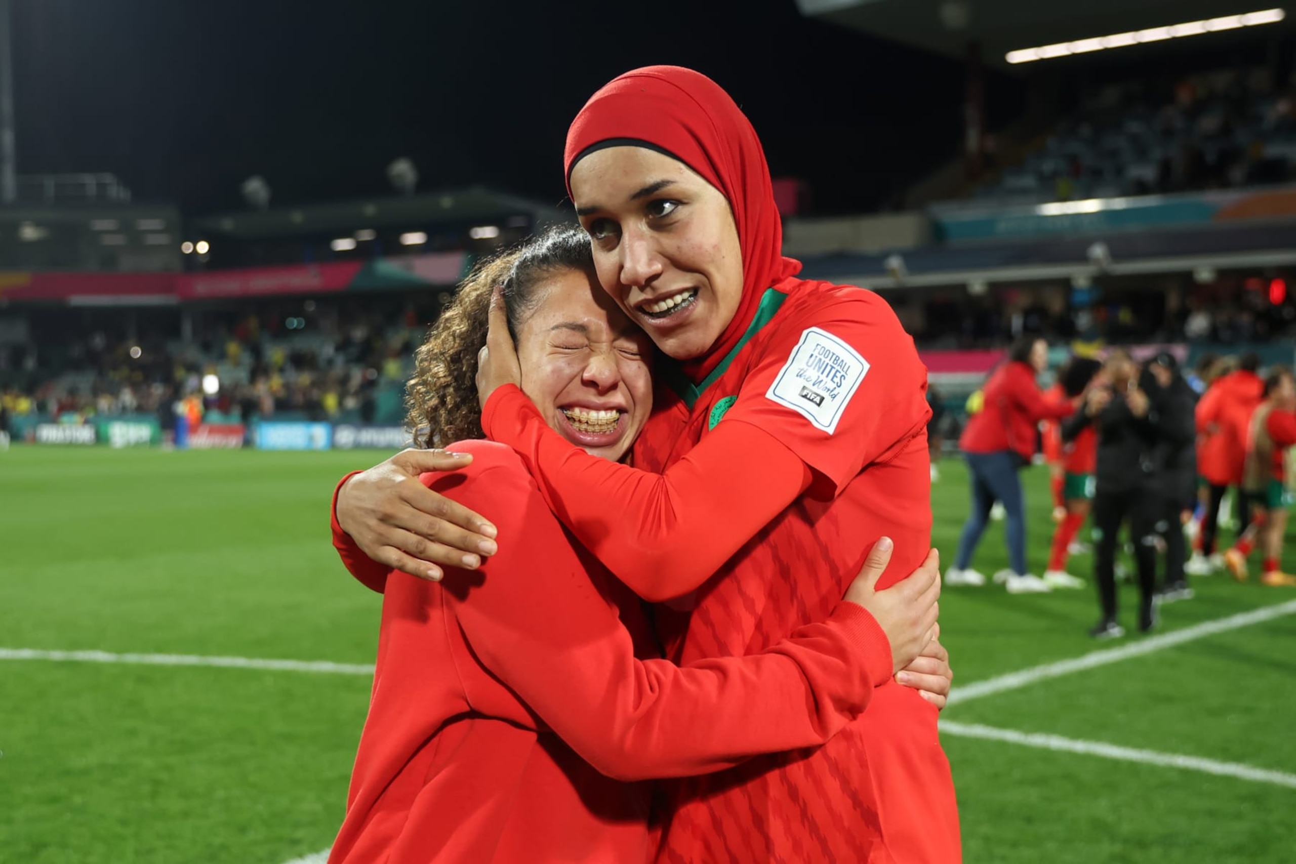 PERTH, AUSTRALIA - AUGUST 03: Fatima Gharbi and Nouhaila Benzina of Morocco celebrate advancing to the knock out stage after the 1-0 victory in the FIFA Women's World Cup Australia & New Zealand 2023 Group H match between Morocco and Colombia at Perth Rectangular Stadium on August 03, 2023 in Perth, Australia. (Photo by Alex Grimm - FIFA/FIFA via Getty Images)