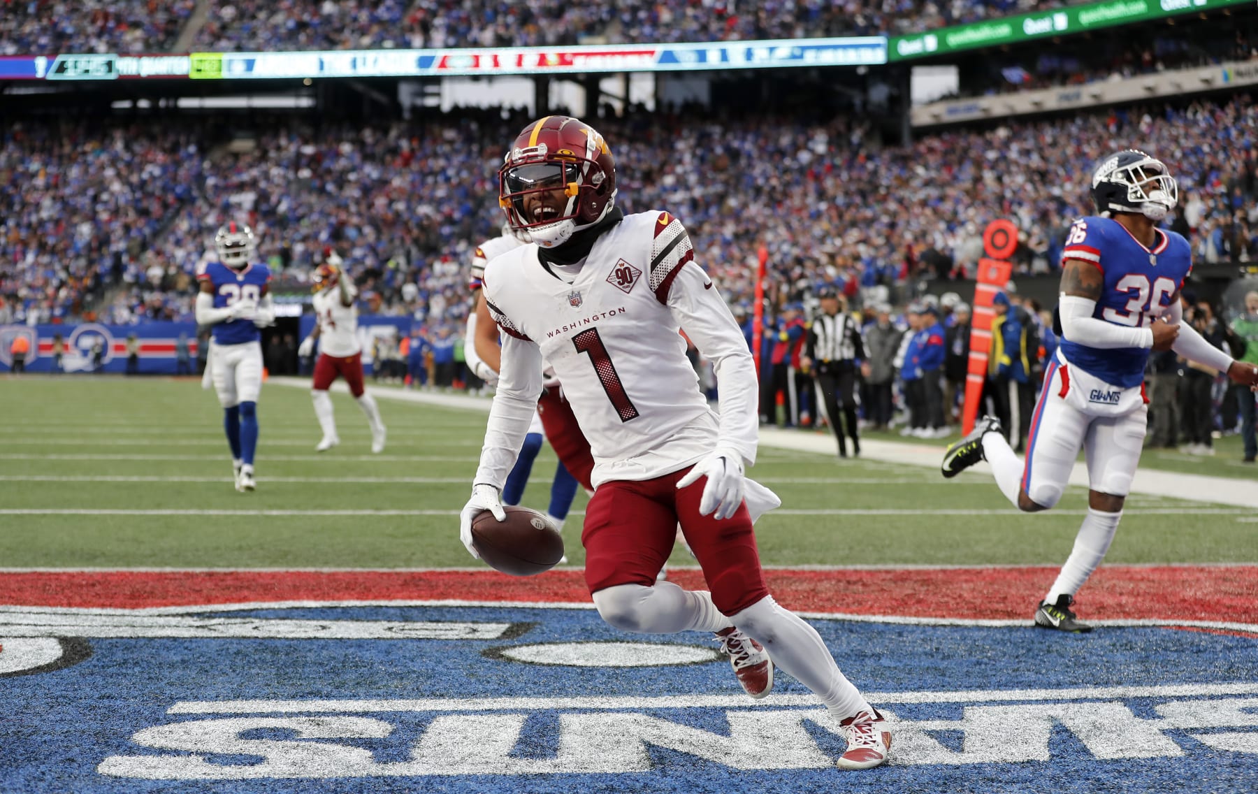 EAST RUTHERFORD, NEW JERSEY - DECEMBER 04: (NEW YORK DAILIES OUT)  Jahan Dotson #1 of the Washington Commanders touchdown against the New York Giants at MetLife Stadium on December 04, 2022 in East Rutherford, New Jersey. The game ended in a 20-20 tie. (Photo by Jim McIsaac/Getty Images)