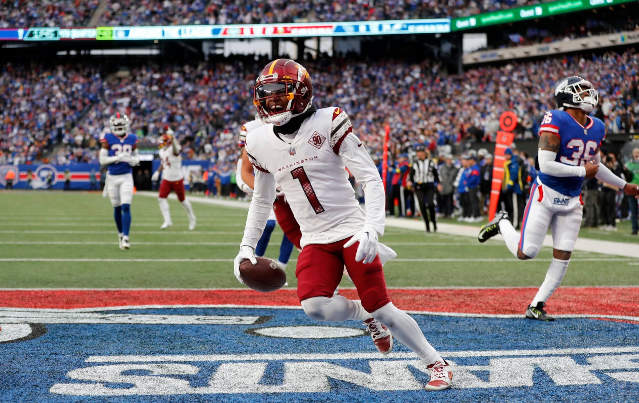EAST RUTHERFORD, NEW JERSEY - DECEMBER 04: (NEW YORK DAILIES OUT)  Jahan Dotson #1 of the Washington Commanders touchdown against the New York Giants at MetLife Stadium on December 04, 2022 in East Rutherford, New Jersey. The game ended in a 20-20 tie. (Photo by Jim McIsaac/Getty Images)