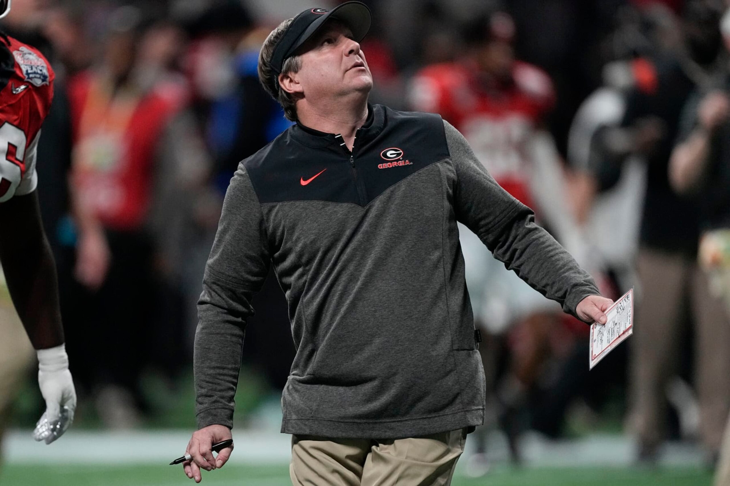 Georgia head coach Kirby Smart walks the turf before the Peach Bowl NCAA college football semifinal playoff game between Georgia and Ohio State, Saturday, Dec. 31, 2022, in Atlanta. (AP Photo/John Bazemore) Georgia head coach Kirby Smart walks the turf before the Peach Bowl NCAA college football semifinal playoff game between Georgia and Ohio State, Saturday, Dec. 31, 2022, in Atlanta. (AP Photo/John Bazemore)