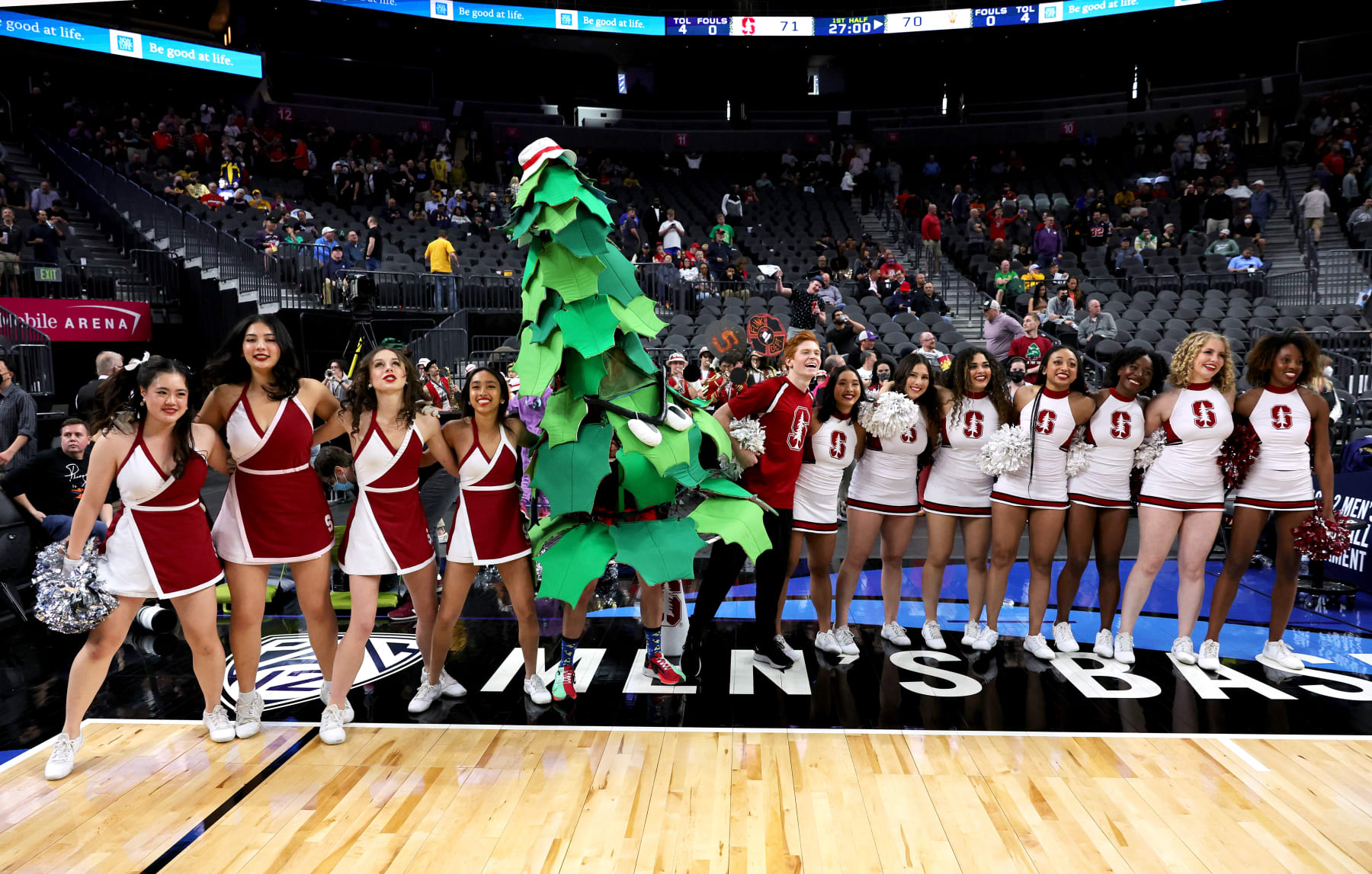 LAS VEGAS, NEVADA - MARCH 09: (L-R) The Stanford Cardinal Dollies, the unofficial Stanford Tree mascot and Stanford cheerleaders perform after the team defeated the Arizona State Sun Devils 71-70 during the first round of the Pac-12 Conference basketball tournament at T-Mobile Arena on March 09, 2022 in Las Vegas, Nevada. (Photo by Ethan Miller/Getty Images)