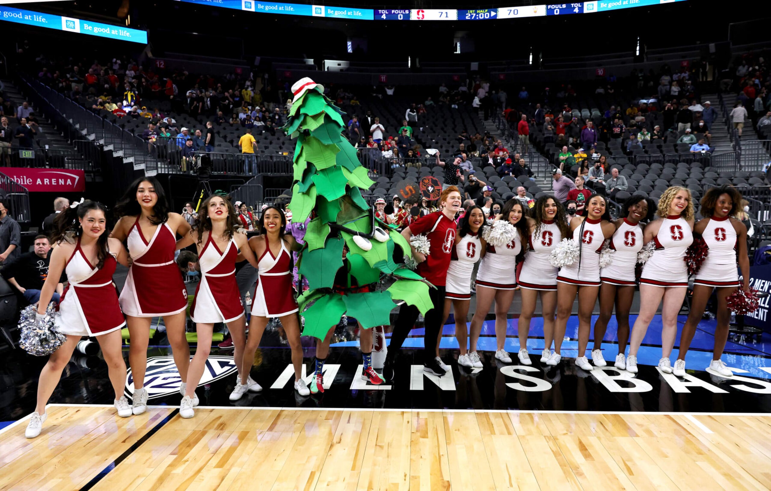 LAS VEGAS, NEVADA - MARCH 09: (L-R) The Stanford Cardinal Dollies, the unofficial Stanford Tree mascot and Stanford cheerleaders perform after the team defeated the Arizona State Sun Devils 71-70 during the first round of the Pac-12 Conference basketball tournament at T-Mobile Arena on March 09, 2022 in Las Vegas, Nevada. (Photo by Ethan Miller/Getty Images)