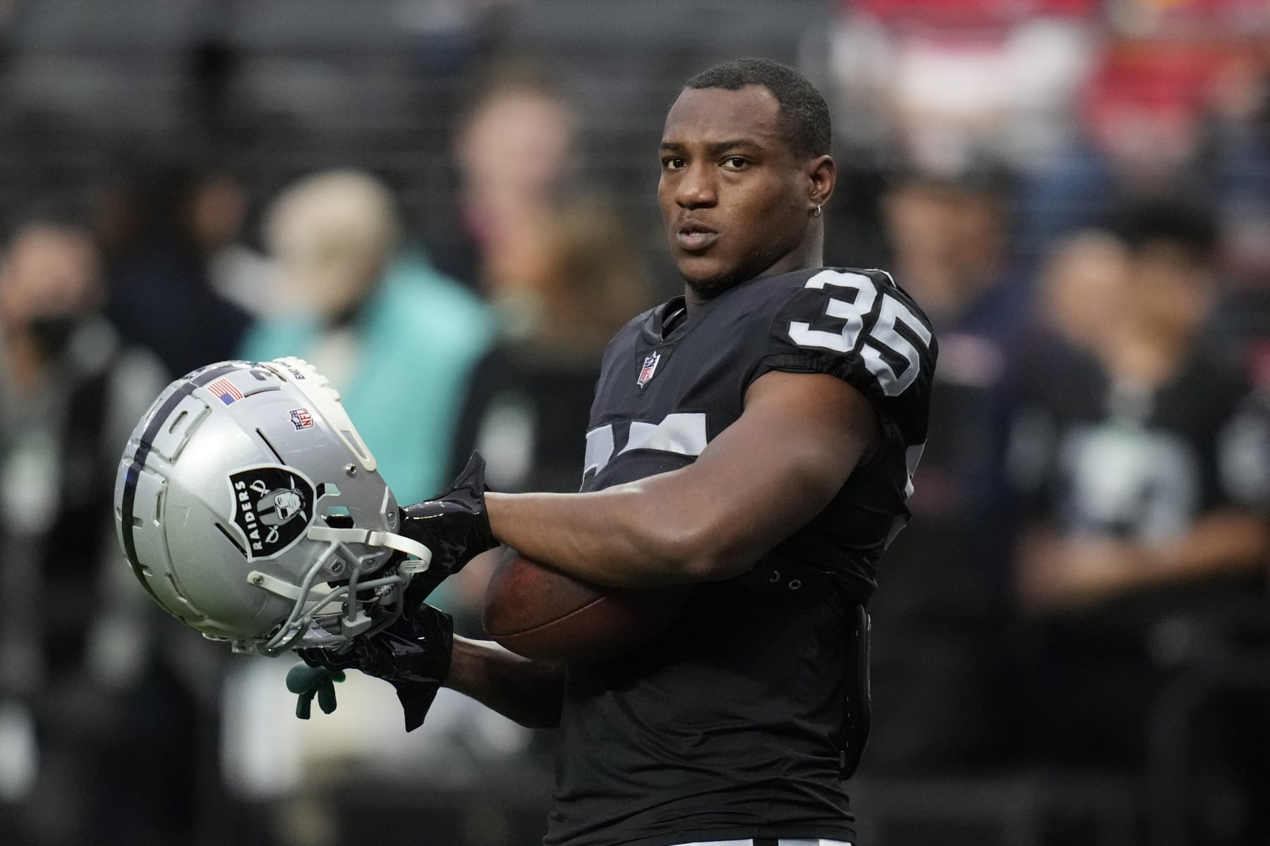Las Vegas Raiders running back Zamir White (35) warms up before an NFL football game against the Kansas City Chiefs, Wednesday, Jan. 11, 2023, in Las Vegas. (AP Photo/John Locher)