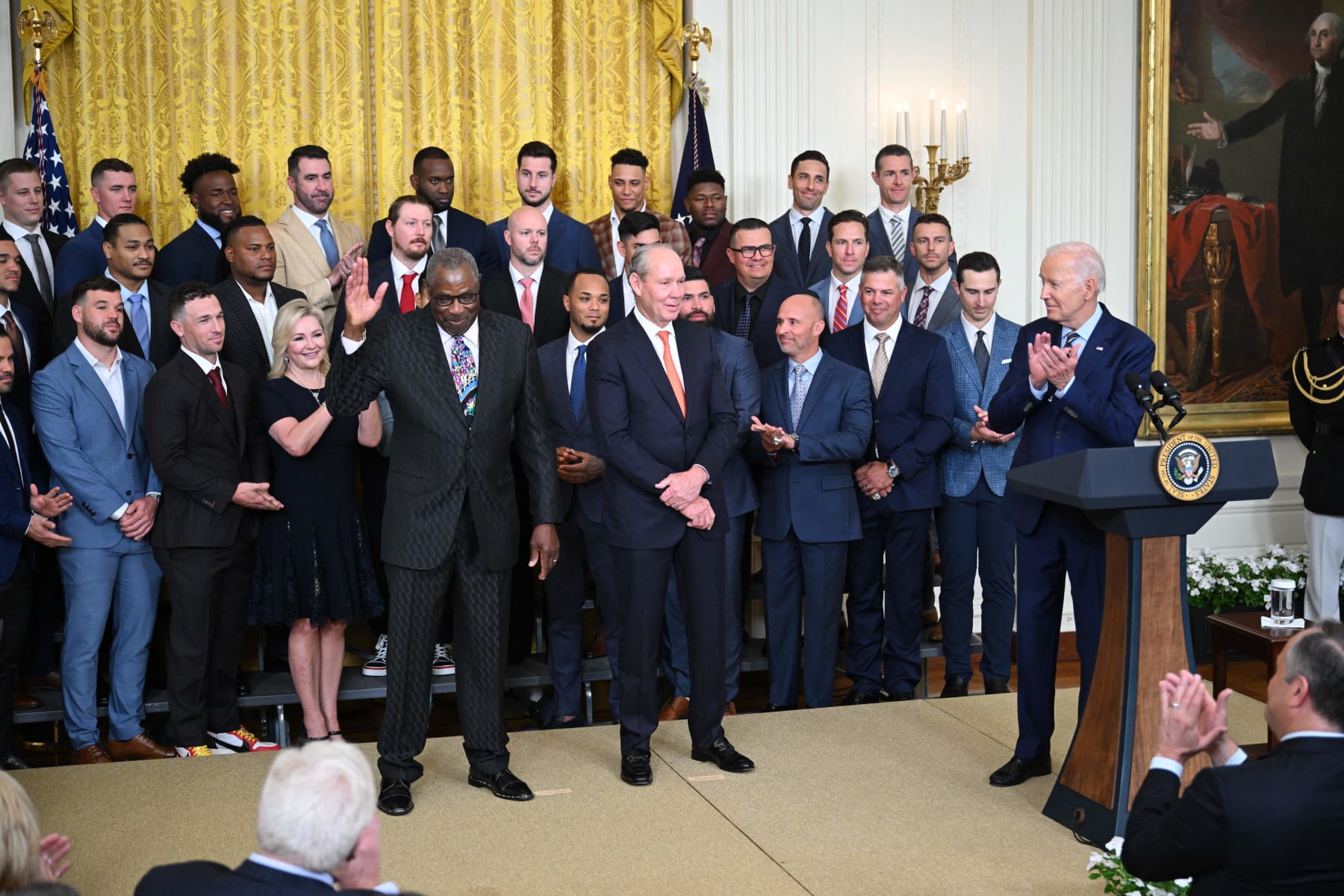US President Joe Biden (R) and Jim Crane, Owner and Chairman of the Houston Astros (C), look on as Dusty Baker Jr., Manager of the Houston Astros, is acknowledged during the celebration of the Houston Astros 2022 World Series victory, in the East Room of the White House in Washington, DC, on August 7, 2023. (Photo by Mandel NGAN / AFP) (Photo by MANDEL NGAN/AFP via Getty Images)