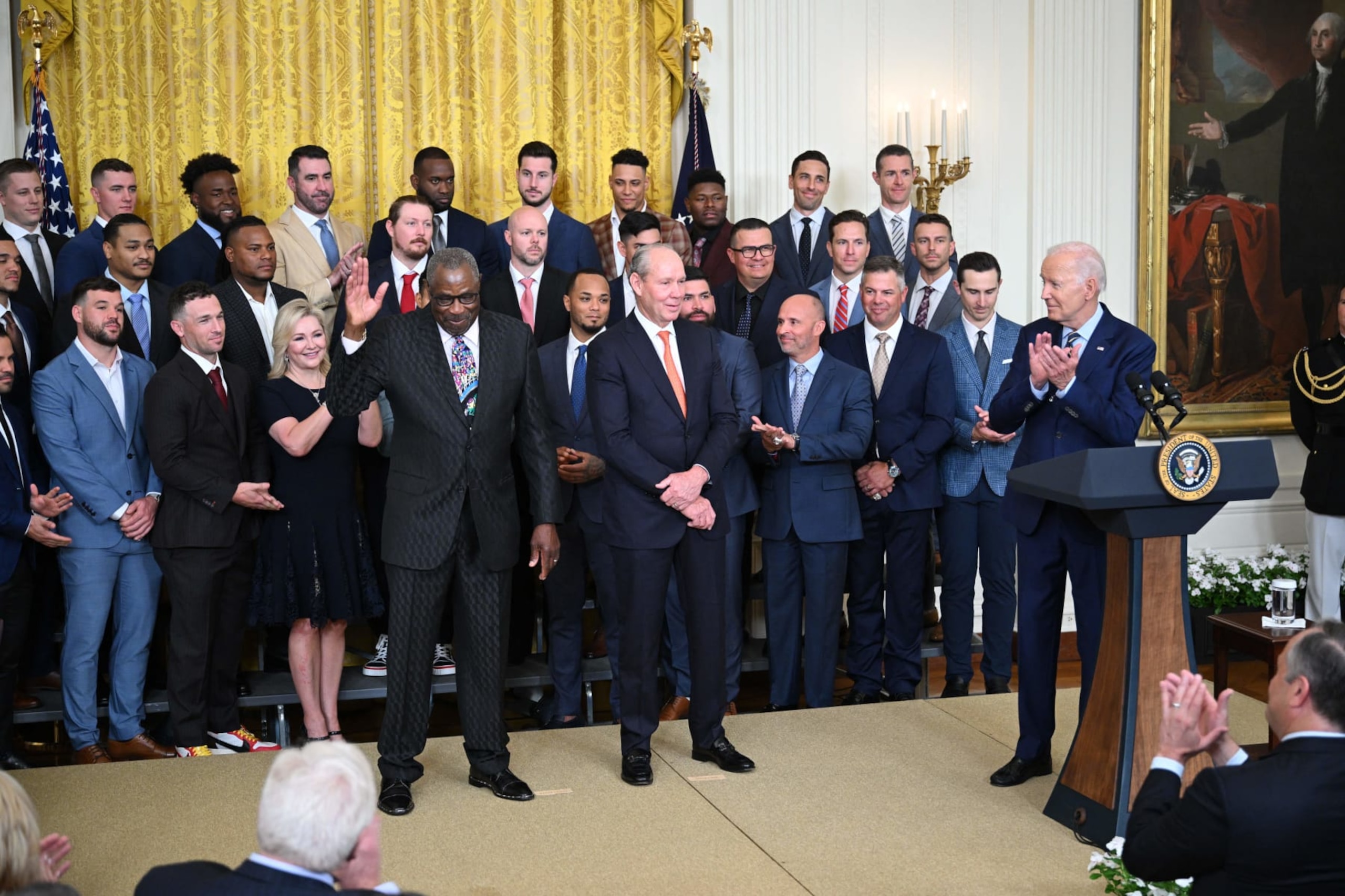 US President Joe Biden (R) and Jim Crane, Owner and Chairman of the Houston Astros (C), look on as Dusty Baker Jr., Manager of the Houston Astros, is acknowledged during the celebration of the Houston Astros 2022 World Series victory, in the East Room of the White House in Washington, DC, on August 7, 2023. (Photo by Mandel NGAN / AFP) (Photo by MANDEL NGAN/AFP via Getty Images)