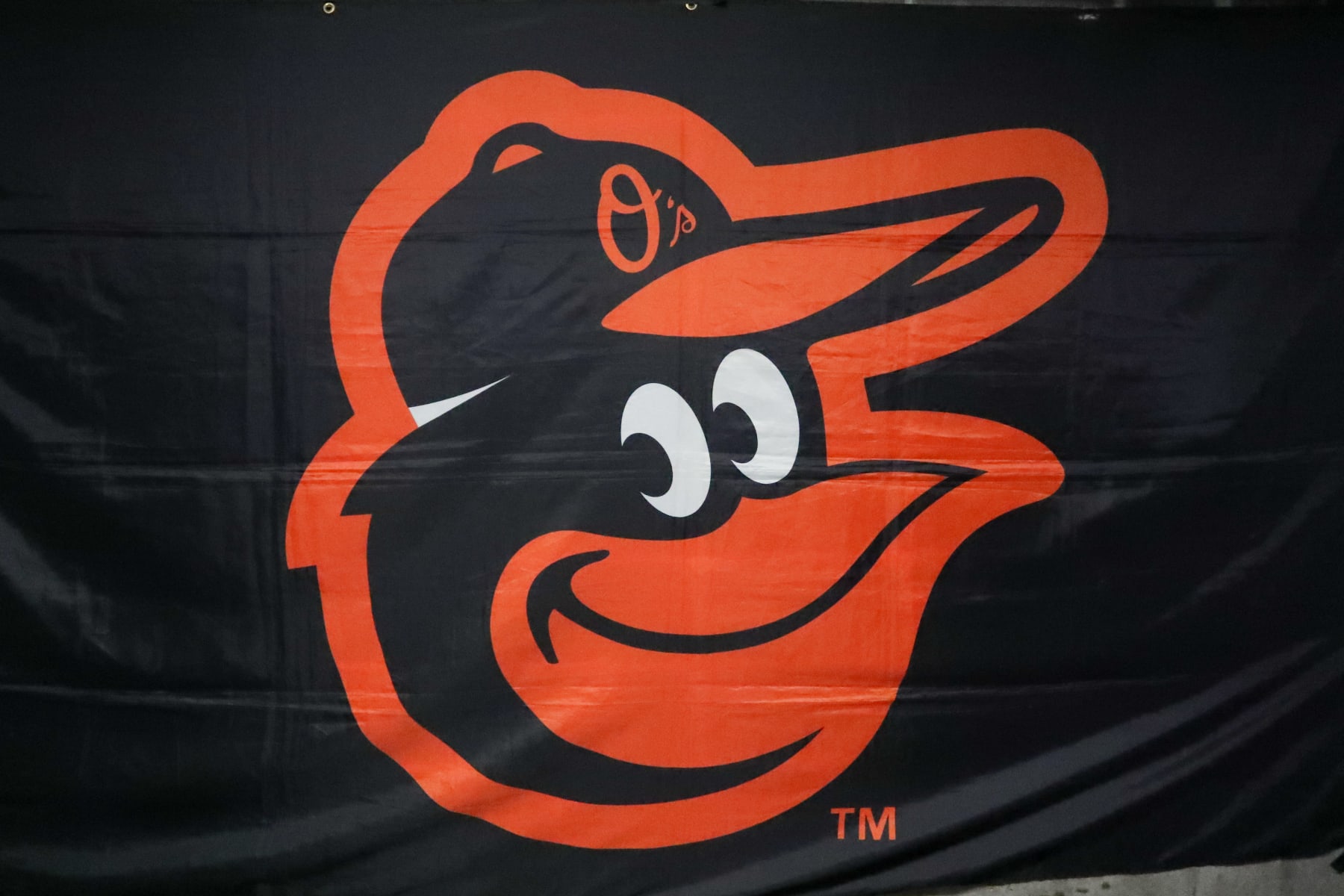 KANSAS CITY, MO - MAY 03: A view of the Baltimore Orioles logo on a flag during an MLB game between the Baltimore Orioles and Kansas City Royals on May 3, 2023 at Kauffman Stadium in Kansas City, MO. (Photo by Scott Winters/Icon Sportswire via Getty Images)