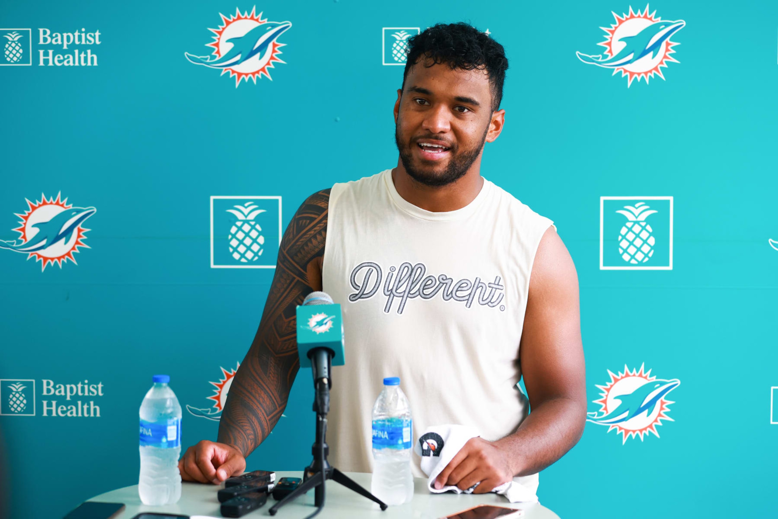 MIAMI GARDENS, FLORIDA - JULY 26: Tua Tagovailoa #1 of the Miami Dolphins speaks to the media after training camp practice at Baptist Health Training Complex on July 26, 2023 in Miami Gardens, Florida. (Photo by Megan Briggs/Getty Images) MIAMI GARDENS, FLORIDA - JULY 26: Tua Tagovailoa #1 of the Miami Dolphins speaks to the media after training camp practice at Baptist Health Training Complex on July 26, 2023 in Miami Gardens, Florida. (Photo by Megan Briggs/Getty Images)
