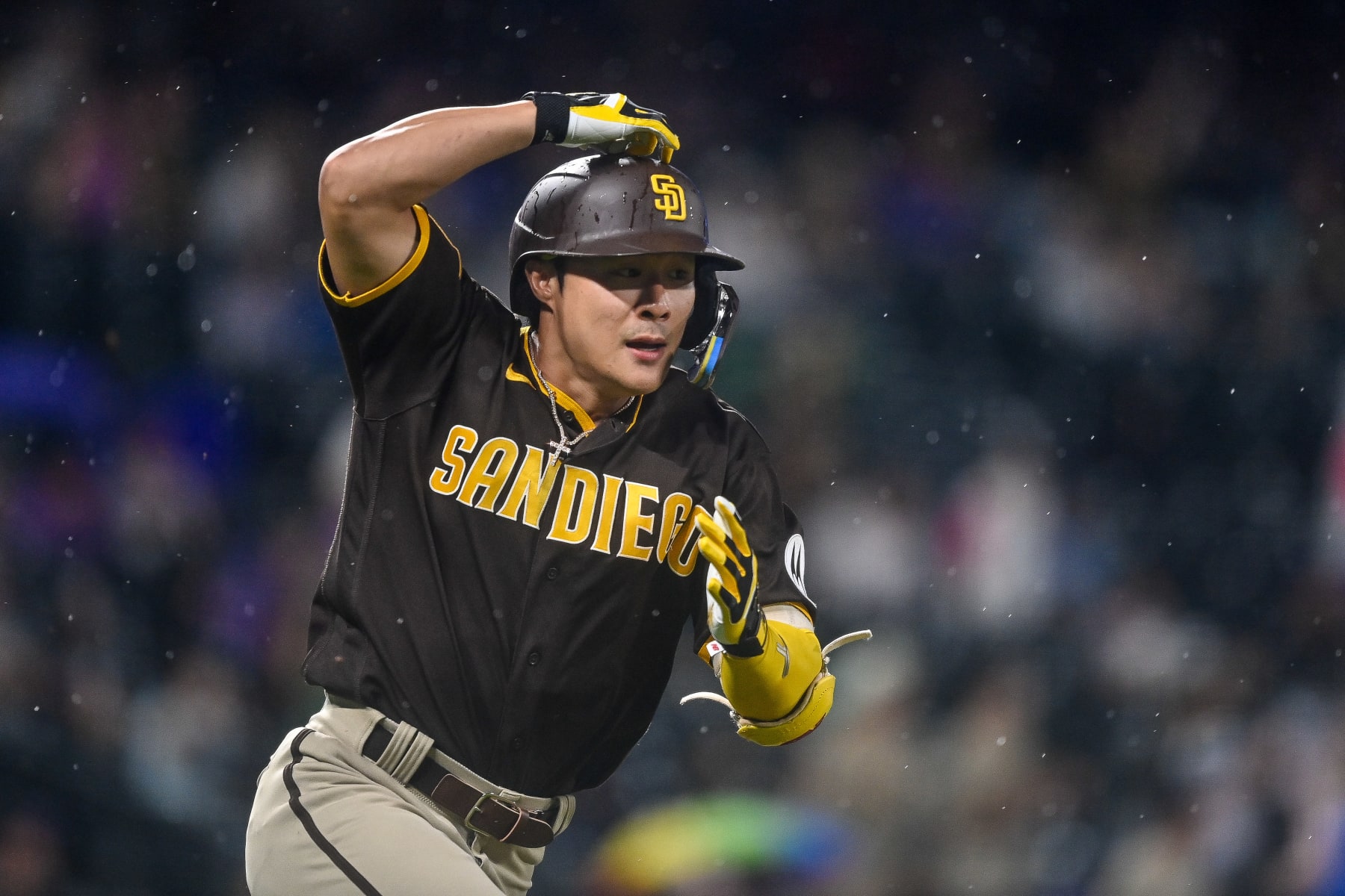 DENVER, CO - JULY 31: Ha-Seong Kim #7 of the San Diego Padres runs after hitting a ninth inning double against the Colorado Rockies at Coors Field on July 31, 2023 in Denver, Colorado. (Photo by Dustin Bradford/Getty Images)