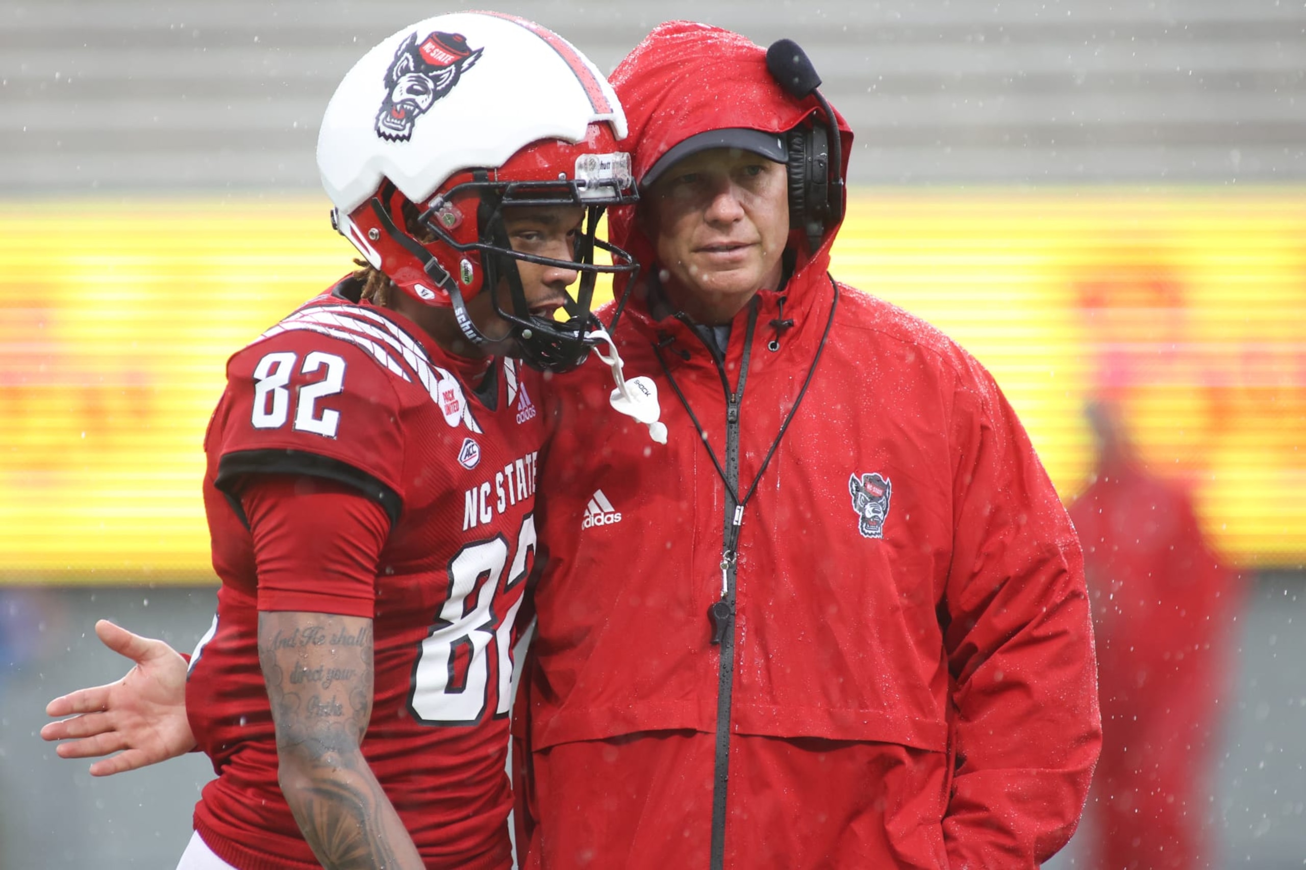 RALEIGH, NC - APRIL 08: Head coach Dave Doeren congratulates NC State wide receiver Terrell Timmons Jr. (82) on his touchdown during the NC State spring football game on April 8, 2023, at Carter-Finley Stadium in Raleigh, NC. (Photo by Nicholas Faulkner/Icon Sportswire via Getty Images)