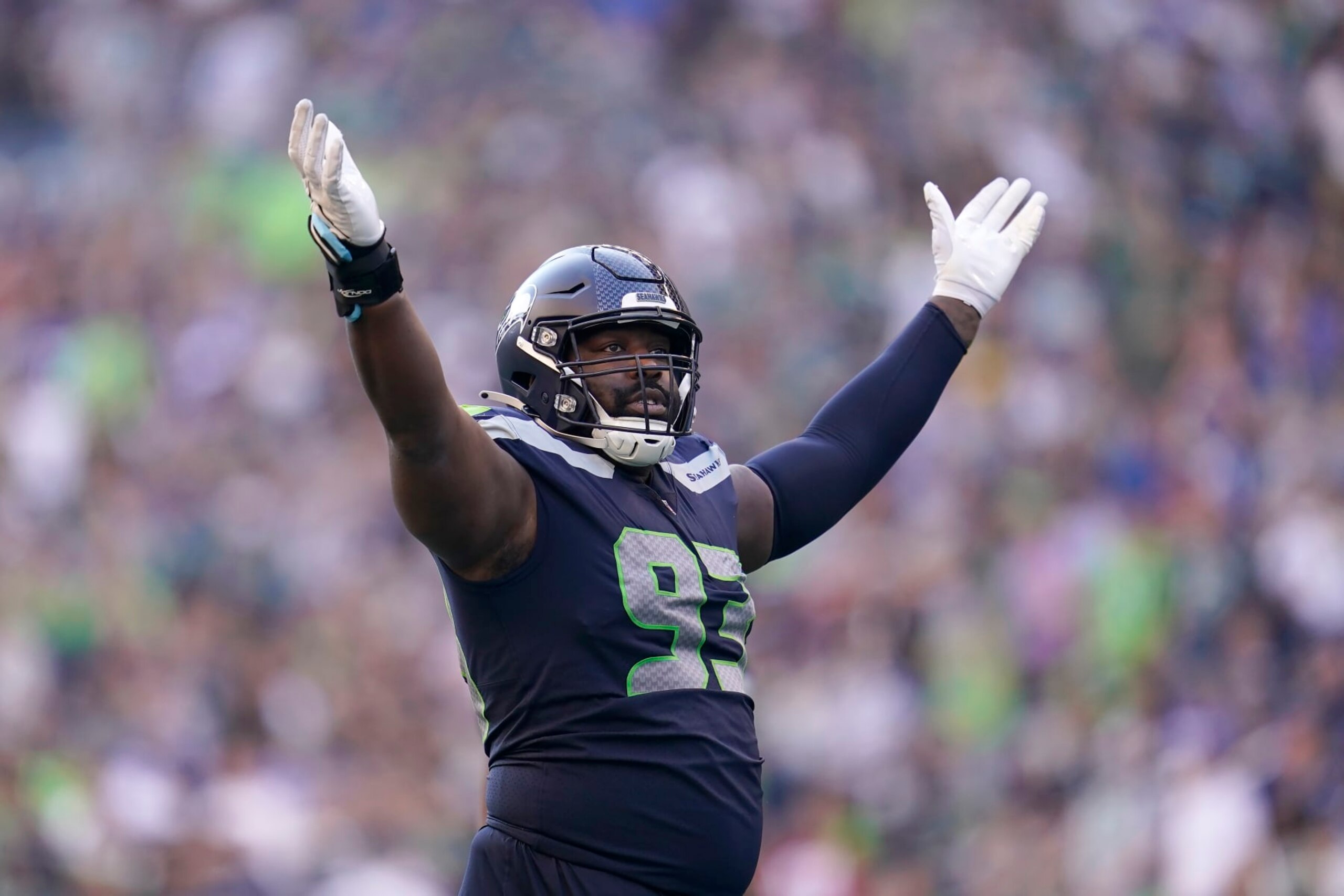 Seattle Seahawks defensive end Shelby Harris (93) gestures toward fans during the second half of an NFL football game against the Arizona Cardinals in Seattle, Sunday, Oct. 16, 2022. (AP Photo/Abbie Parr) Seattle Seahawks defensive end Shelby Harris (93) gestures toward fans during the second half of an NFL football game against the Arizona Cardinals in Seattle, Sunday, Oct. 16, 2022. (AP Photo/Abbie Parr)