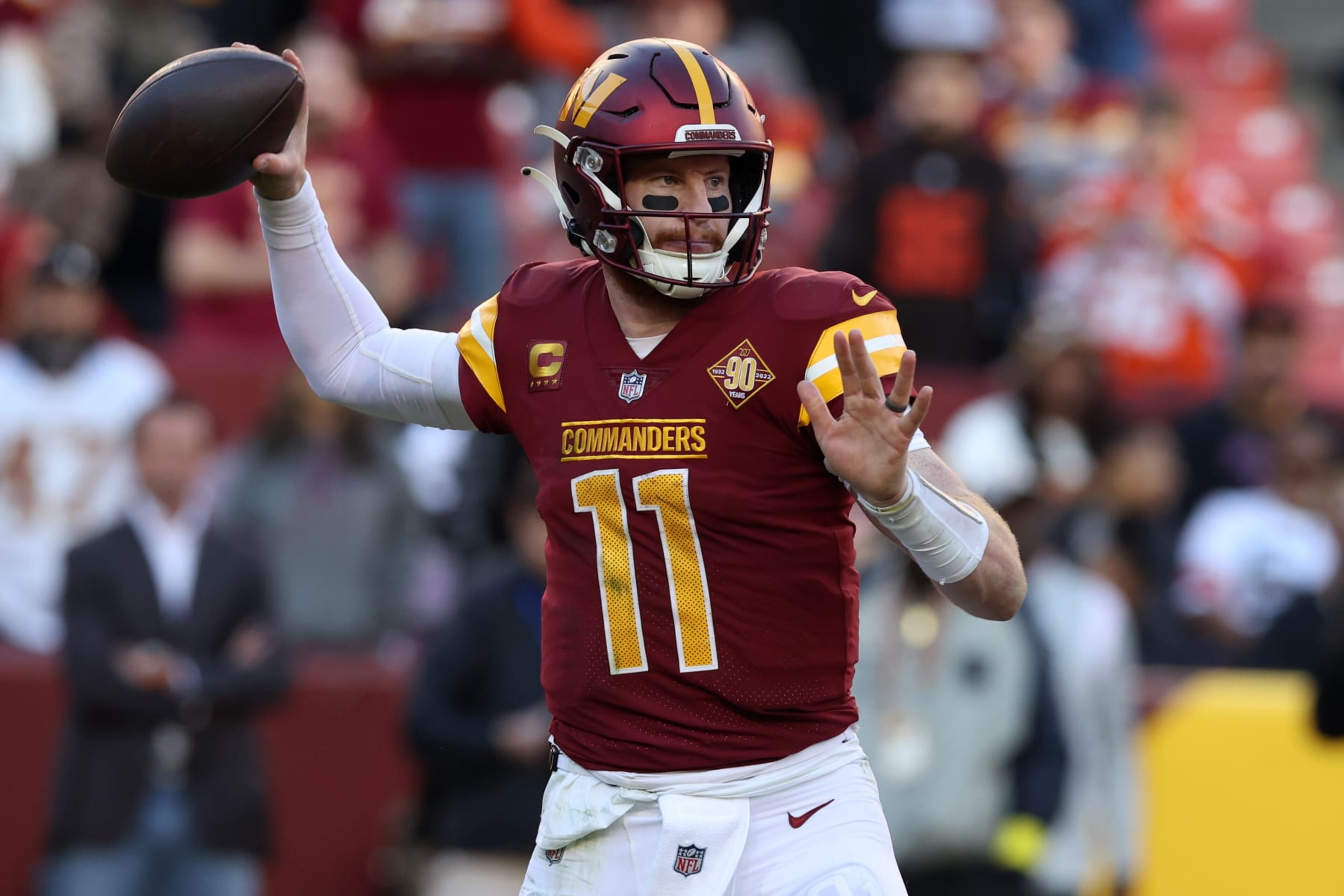LANDOVER, MARYLAND - JANUARY 01: Carson Wentz #11 of the Washington Commanders throws a pass during the second half against the Cleveland Browns at FedExField on January 01, 2023 in Landover, Maryland. (Photo by Todd Olszewski/Getty Images)