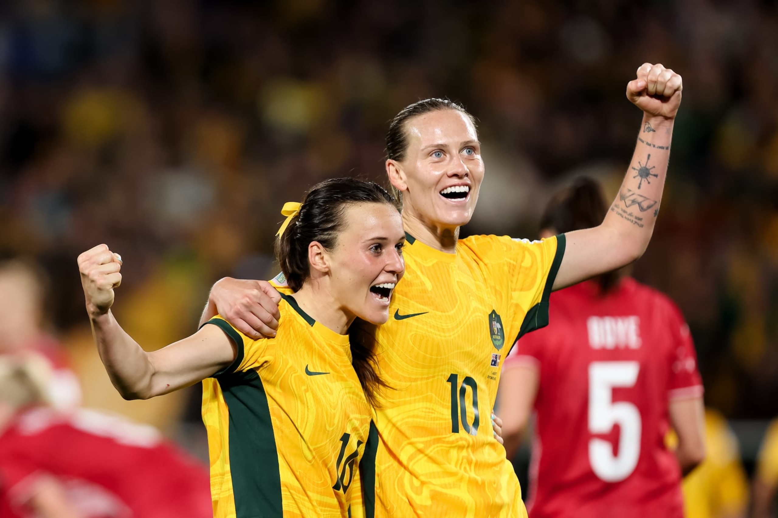 SYDNEY, AUSTRALIA - AUGUST 07: Hayley Raso of Australia celebrates her goal with Emily van Egmond of Australia during the Women's World Cup round of 16 football match between the Australia Matildas and Denmark at Stadium Australia on August 07, 2023 in Sydney, Australia.  (Photo by Damian Briggs/Speed Media/Icon Sportswire via Getty Images)