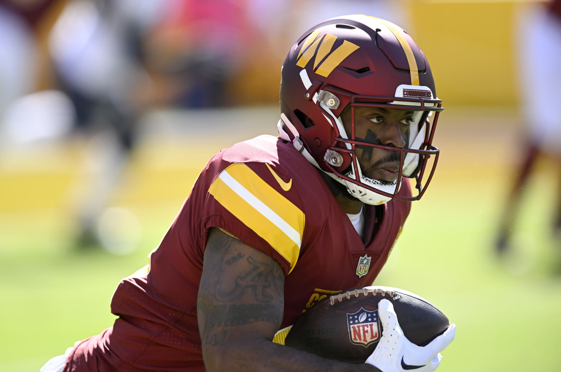 LANDOVER, MARYLAND - OCTOBER 09: J.D. McKissic #23 of the Washington Commanders rushes the ball against the Tennessee Titans at FedExField on October 09, 2022 in Landover, Maryland. (Photo by G Fiume/Getty Images)