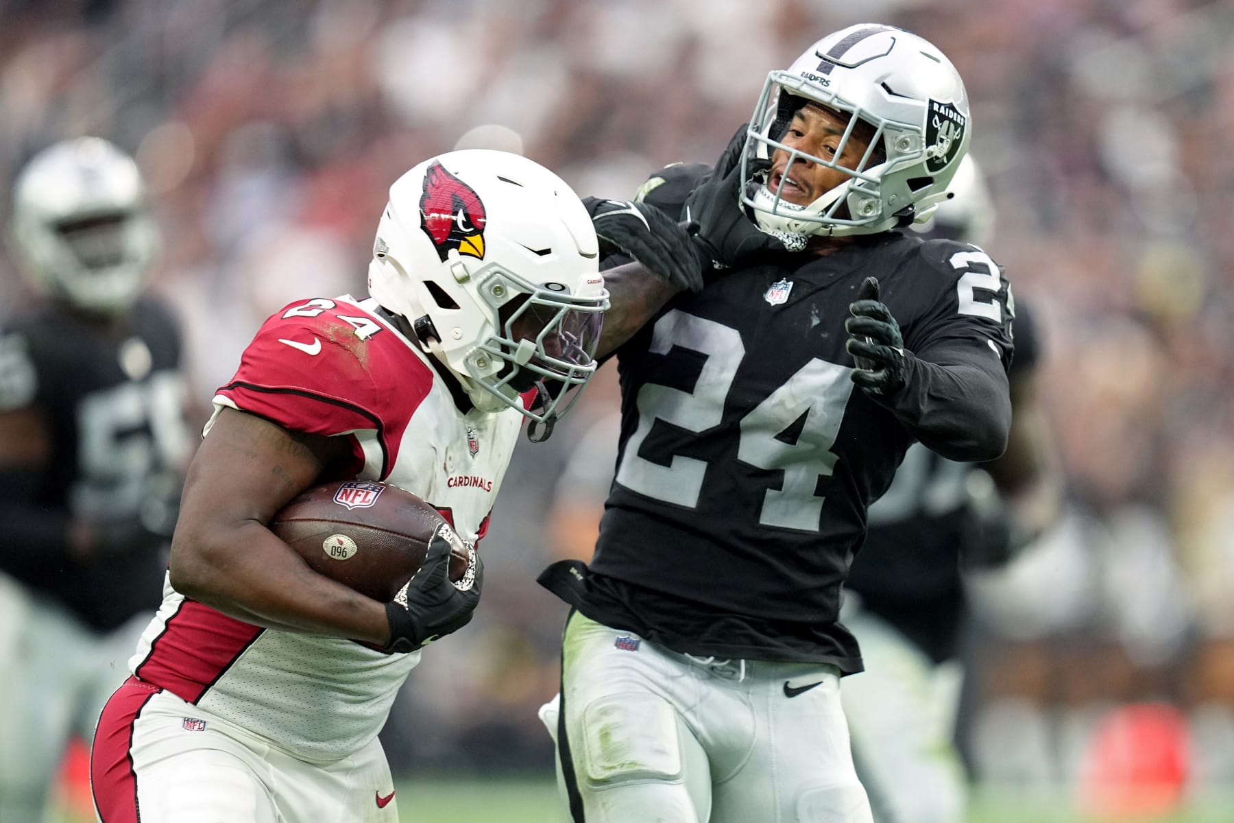 LAS VEGAS, NEVADA - SEPTEMBER 18: Darrel Williams #24 of the Arizona Cardinals carries the ball against Johnathan Abram #24 of the Las Vegas Raiders in the second half at Allegiant Stadium on September 18, 2022 in Las Vegas, Nevada. (Photo by Jeff Bottari/Getty Images)