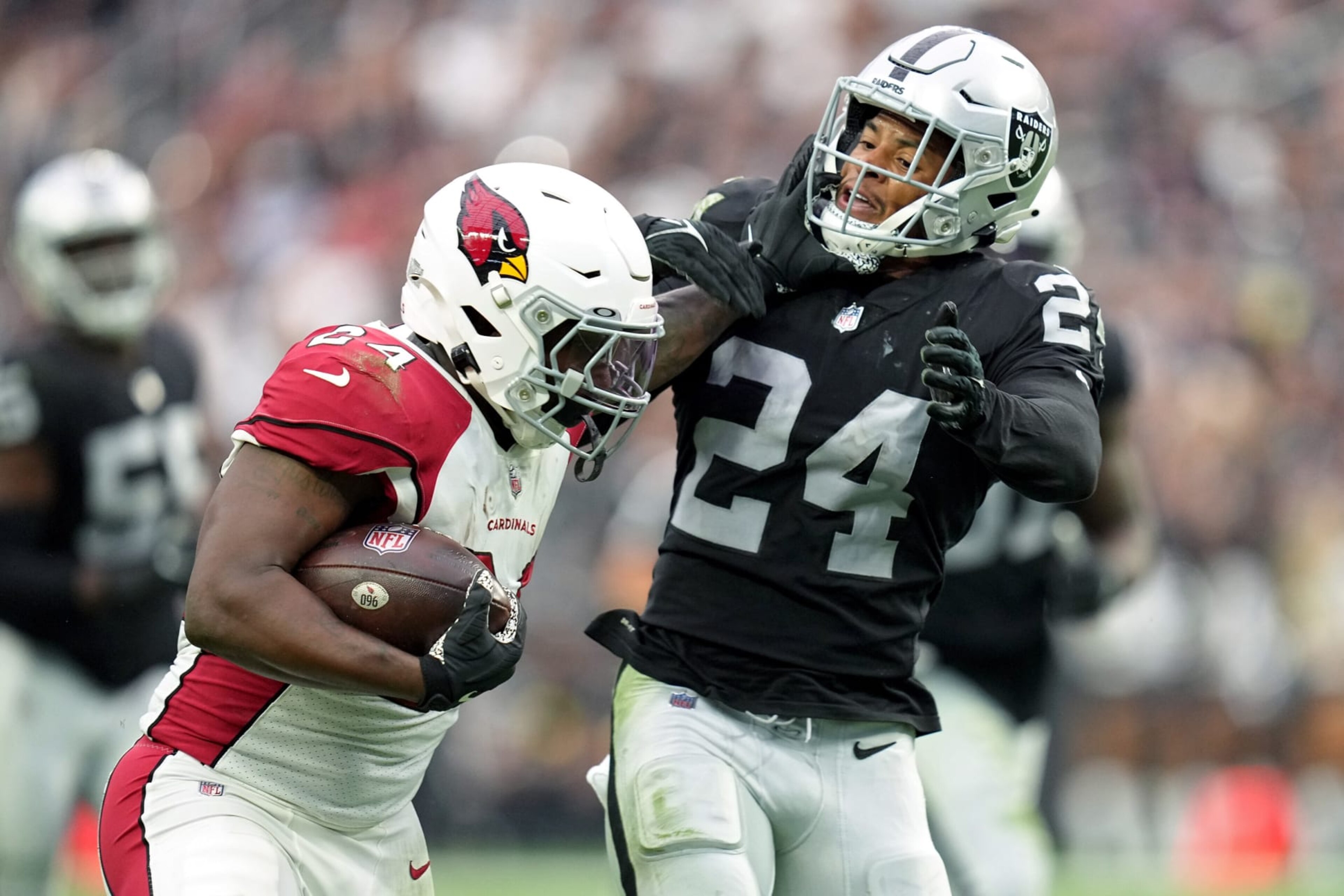 LAS VEGAS, NEVADA - SEPTEMBER 18: Darrel Williams #24 of the Arizona Cardinals carries the ball against Johnathan Abram #24 of the Las Vegas Raiders in the second half at Allegiant Stadium on September 18, 2022 in Las Vegas, Nevada. (Photo by Jeff Bottari/Getty Images) LAS VEGAS, NEVADA - SEPTEMBER 18: Darrel Williams #24 of the Arizona Cardinals carries the ball against Johnathan Abram #24 of the Las Vegas Raiders in the second half at Allegiant Stadium on September 18, 2022 in Las Vegas, Nevada. (Photo by Jeff Bottari/Getty Images)