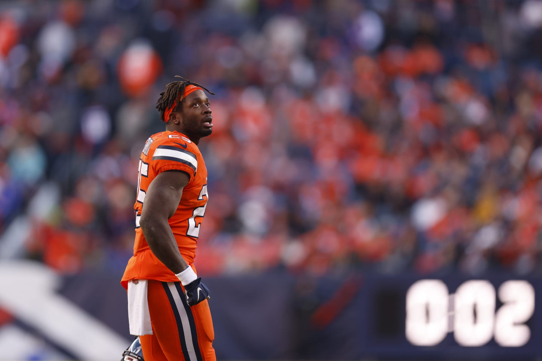 DENVER, COLORADO - NOVEMBER 20: Melvin Gordon III #25 of the Denver Broncos walks off the field after fumbling the football in the second quarter of a game against the Las Vegas Raiders at Empower Field At Mile High on November 20, 2022 in Denver, Colorado. (Photo by Justin Edmonds/Getty Images)