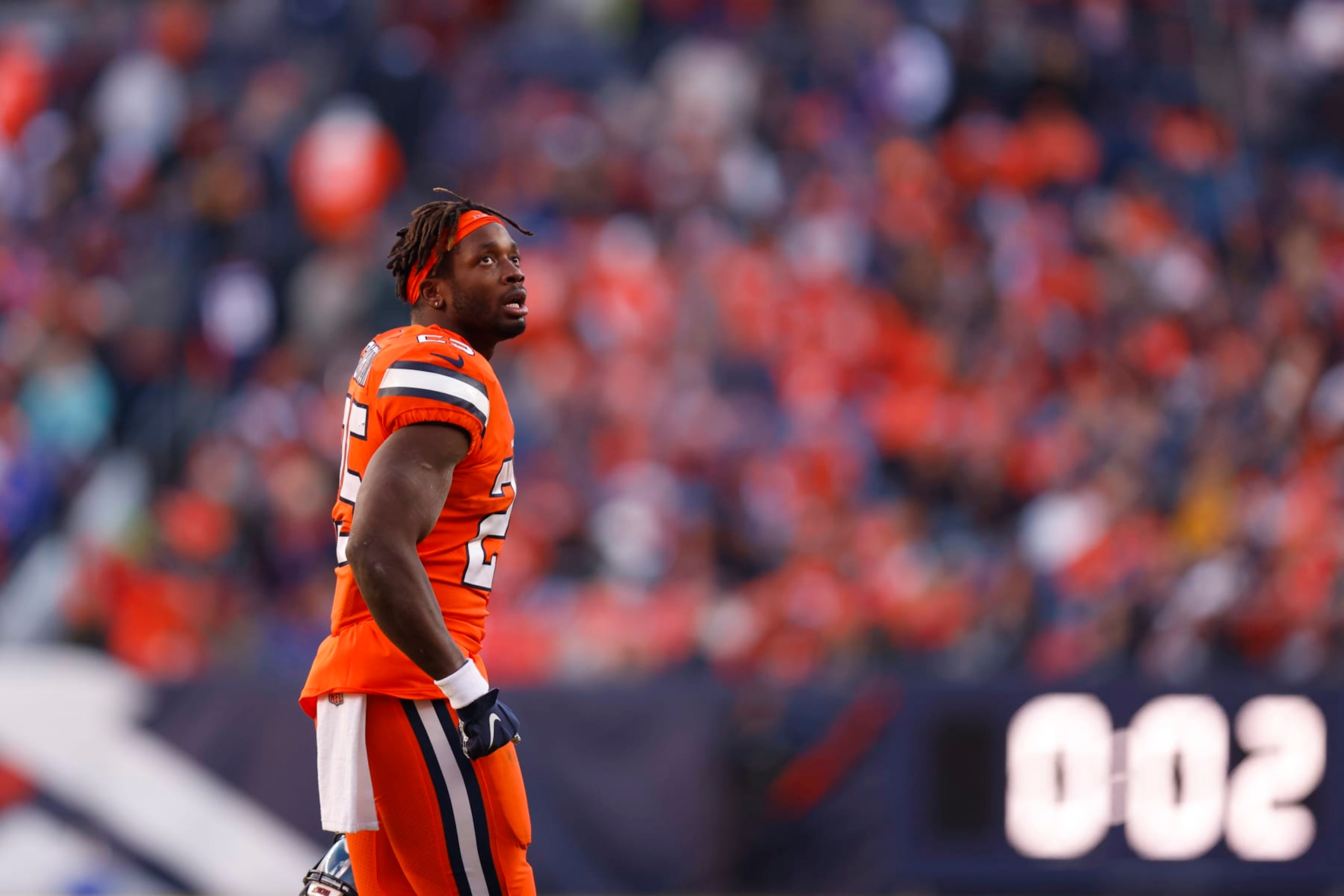 DENVER, COLORADO - NOVEMBER 20: Melvin Gordon III #25 of the Denver Broncos walks off the field after fumbling the football in the second quarter of a game against the Las Vegas Raiders at Empower Field At Mile High on November 20, 2022 in Denver, Colorado. (Photo by Justin Edmonds/Getty Images)