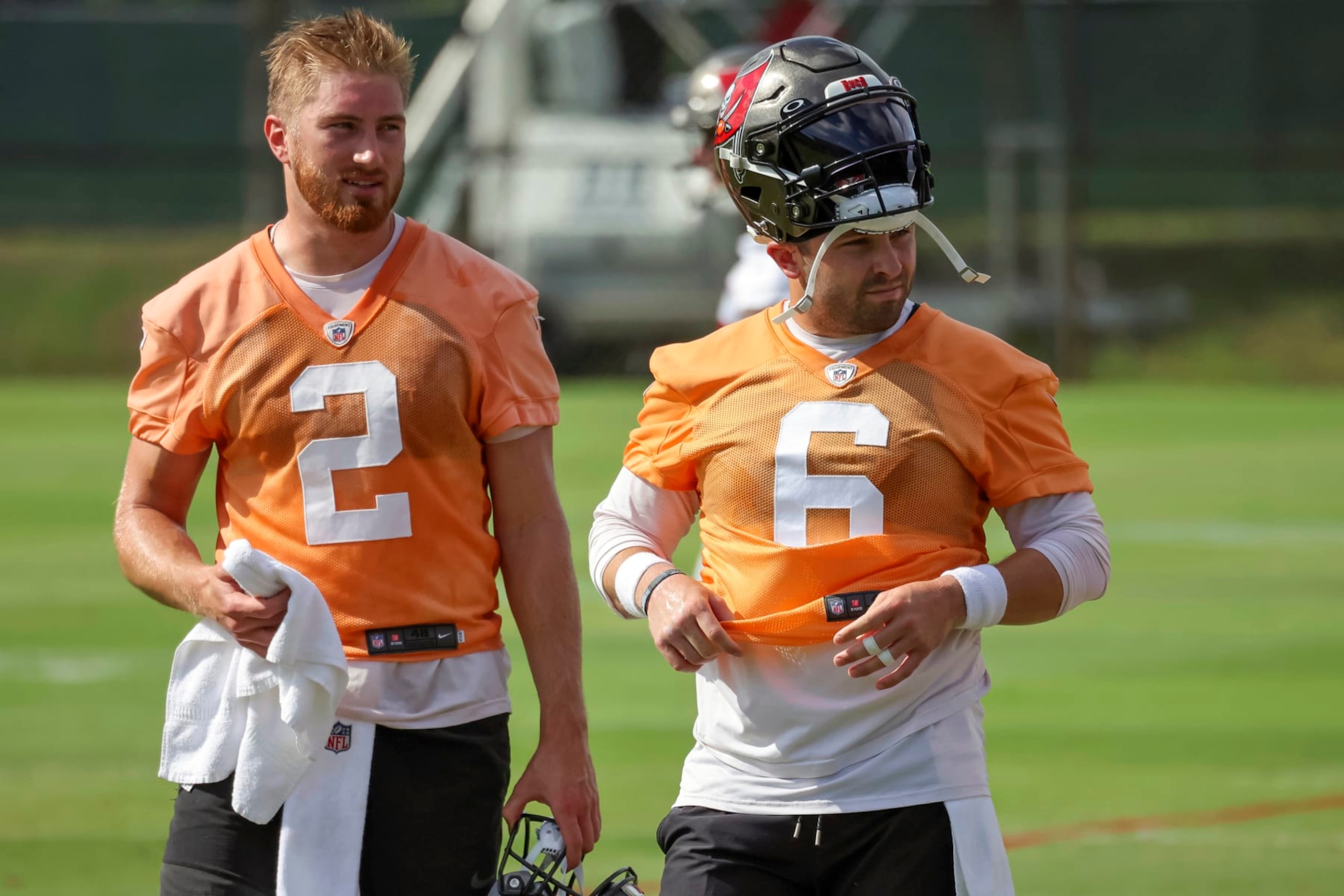 Tampa Bay Buccaneers quarterbacks Kyle Trask (2), and Baker Mayfield (6) move between drills during NFL football practice Tuesday, June 13, 2023, in Tampa, Fla. (AP Photo/Mike Carlson)