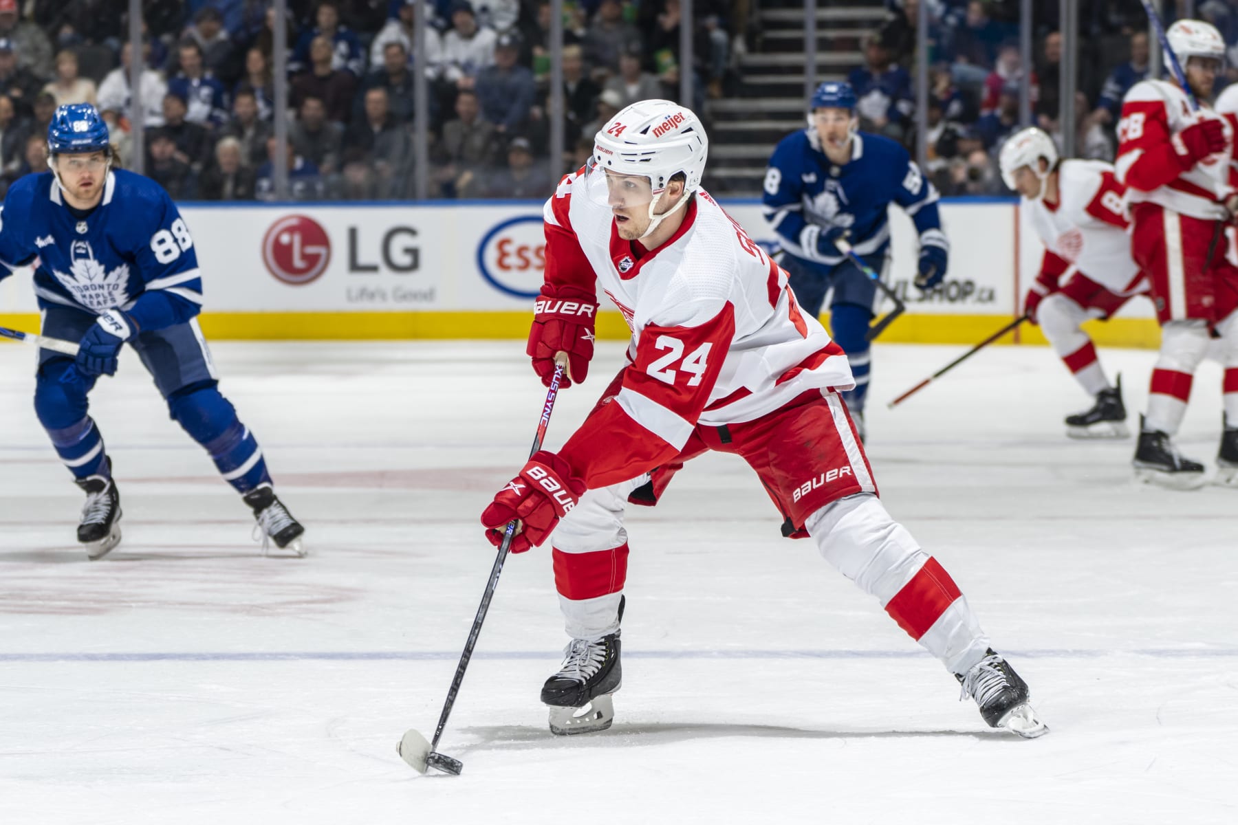 TORONTO, ON - APRIL 2: Pius Suter #24 of the Detroit Red Wings moves the puck against the Toronto Maple Leafs during the first period at the Scotiabank Arena on April 2, 2023 in Toronto, Ontario, Canada. (Photo by Kevin Sousa/NHLI via Getty Images)