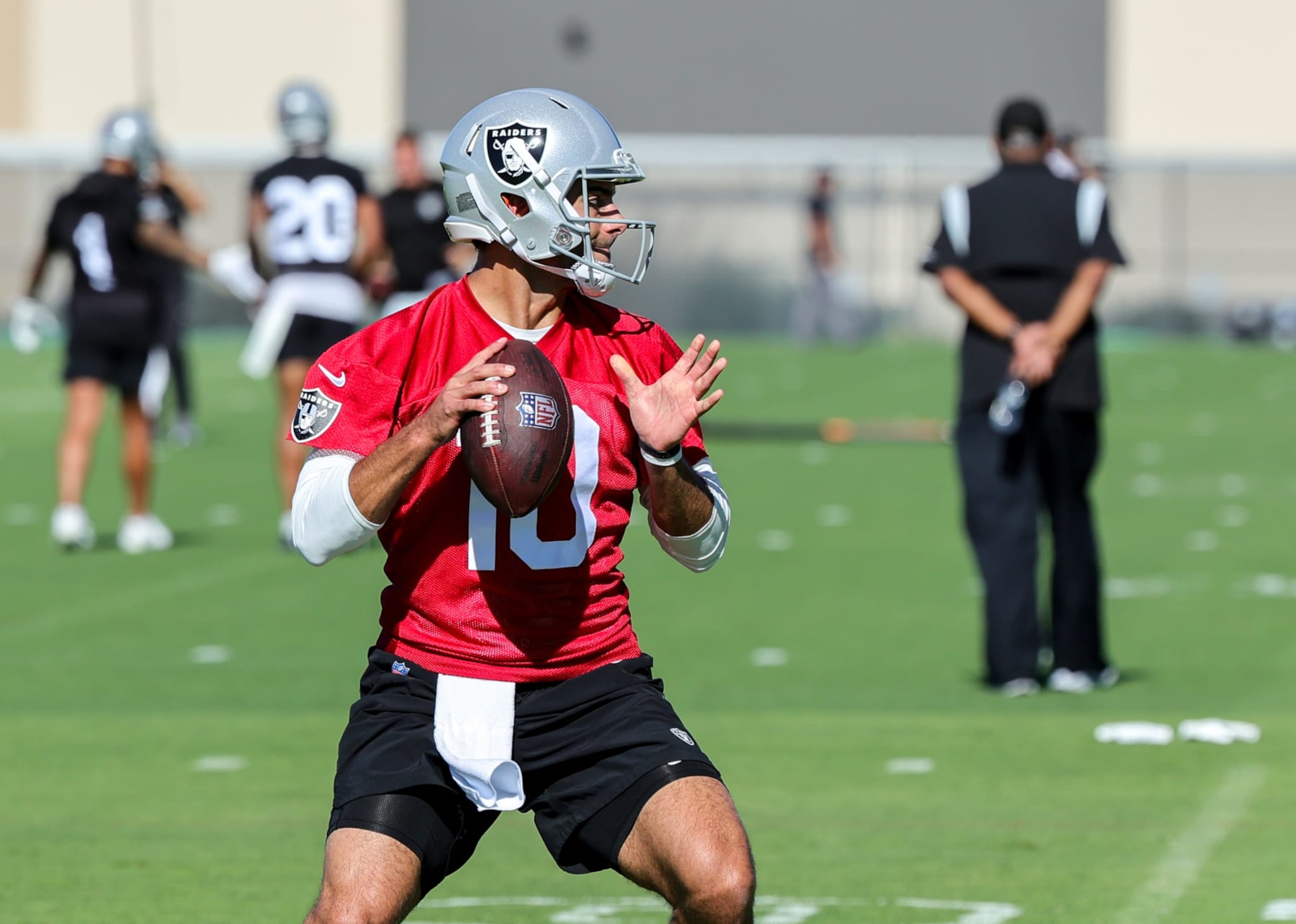 HENDERSON, NEVADA - JULY 27: Quarterback Jimmy Garoppolo #10 of the Las Vegas Raiders throws during the team's training camp at the Las Vegas Raiders Headquarters/Intermountain Healthcare Performance Center on July 27, 2023 in Henderson, Nevada. (Photo by Ethan Miller/Getty Images)