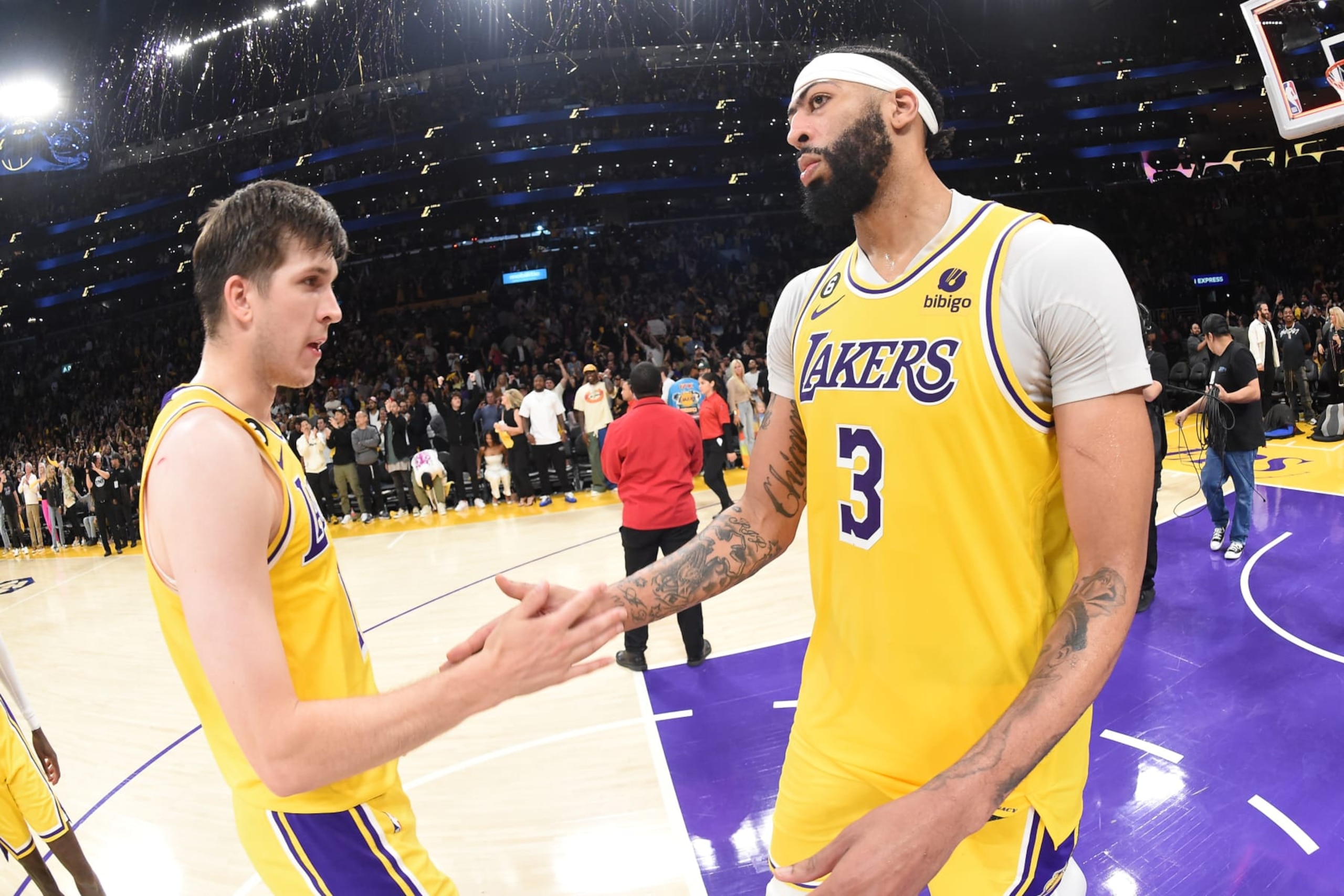 LOS ANGELES, CA - APRIL 24: Anthony Davis #3 and Austin Reaves #15 of the Los Angeles Lakers after Round One Game Four of the 2023 NBA Playoffs between the Memphis Grizzlies on April 24, 2023 at Crypto.Com Arena in Los Angeles, California. NOTE TO USER: User expressly acknowledges and agrees that, by downloading and/or using this Photograph, user is consenting to the terms and conditions of the Getty Images License Agreement. Mandatory Copyright Notice: Copyright 2023 NBAE (Photo by Andrew D. Bernstein/NBAE via Getty Images)