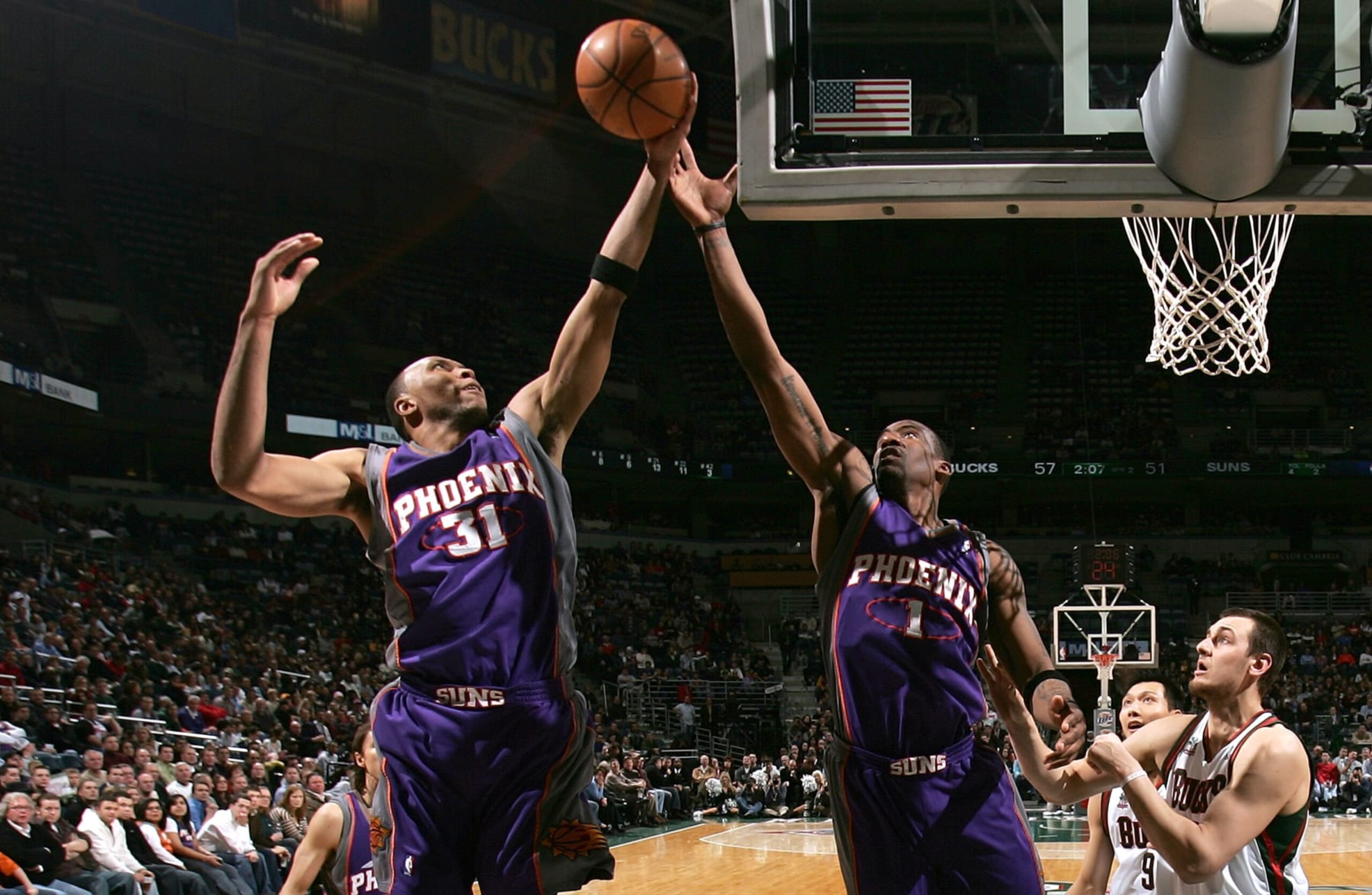 MILWAUKEE - JANUARY 22: (L-R) Shawn Marion #31 and Amare Stoudemire #1 of the Phoenix Suns reach for a rebound against Andre Bogut #6 of the Milwaukee Bucks at the Bradley Center on January 22, 2008 in Milwaukee, Wisconsin. NOTE TO USER: User expressly acknowledges and agrees that, by downloading and/or using this Photograph, user is consenting to the terms and conditions of the Getty Images License Agreement. (Photo by Jonathan Daniel/Getty Images) MILWAUKEE - JANUARY 22: (L-R) Shawn Marion #31 and Amare Stoudemire #1 of the Phoenix Suns reach for a rebound against Andre Bogut #6 of the Milwaukee Bucks at the Bradley Center on January 22, 2008 in Milwaukee, Wisconsin. NOTE TO USER: User expressly acknowledges and agrees that, by downloading and/or using this Photograph, user is consenting to the terms and conditions of the Getty Images License Agreement. (Photo by Jonathan Daniel/Getty Images)