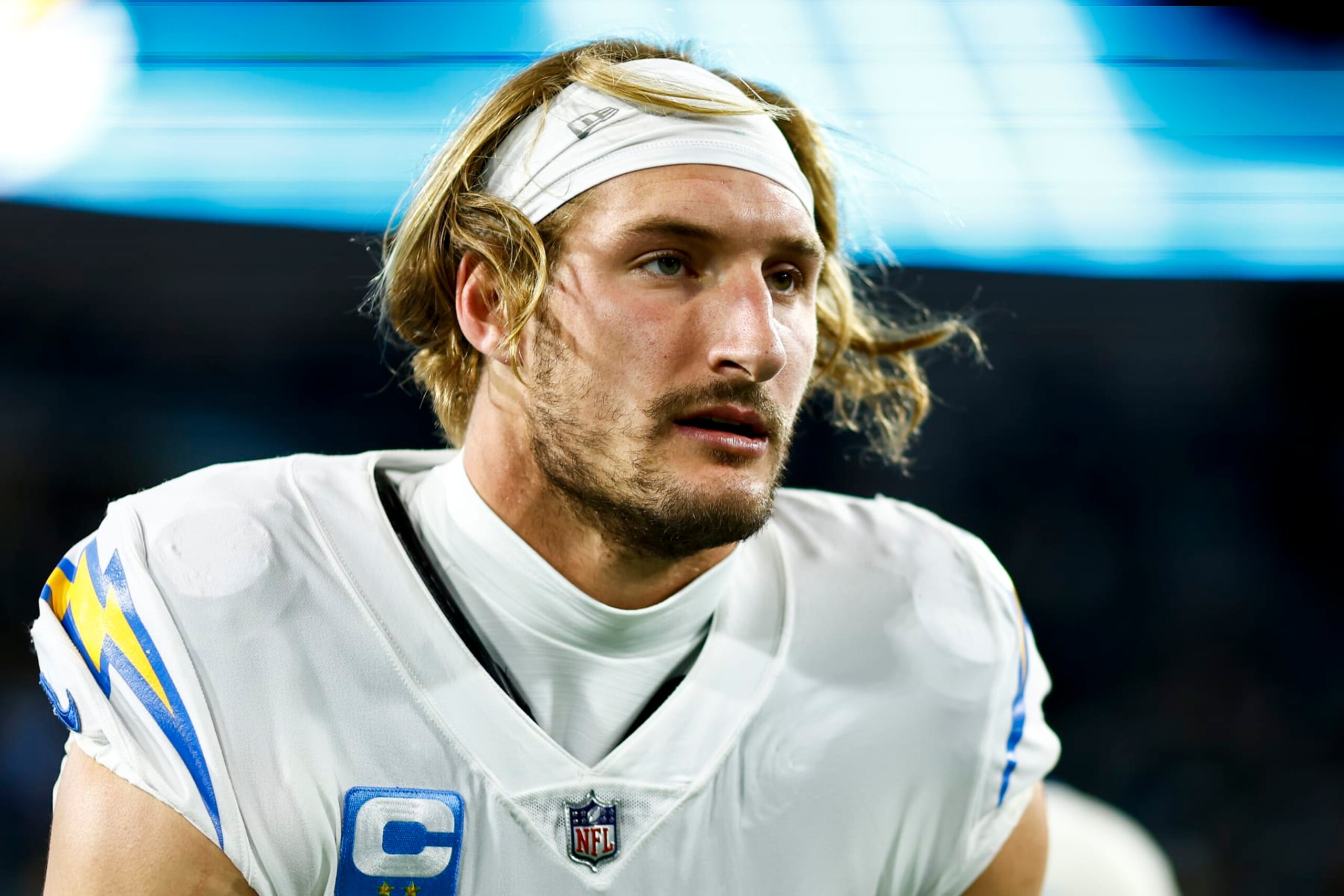 JACKSONVILLE, FL - JANUARY 14: Joey Bosa #97 of the Los Angeles Chargers stretches prior to an NFL wild card playoff football game against the Jacksonville Jaguars at TIAA Bank Field on January 14, 2023 in Jacksonville, Florida. (Photo by Kevin Sabitus/Getty Images)