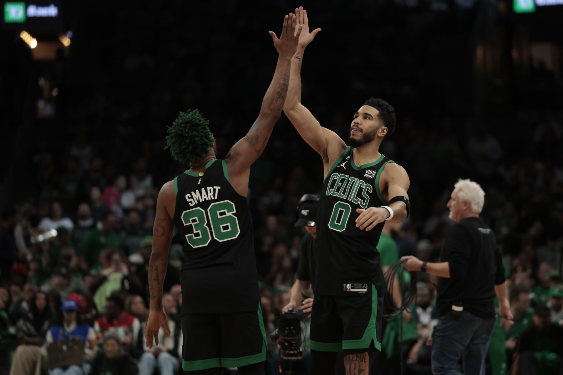 BOSTON, MASSACHUSETTS - DECEMBER 02: Jayson Tatum #0 of the Boston Celtics reacts with Marcus Smart #36 of the Boston Celtics prior to the start of the game between the Celtics and the Heat at TD Garden on December 02, 2022 in Boston, Massachusetts. NOTE TO USER: User expressly acknowledges and agrees that, by downloading and or using this photograph, User is consenting to the terms and conditions of the Getty Images License Agreement. (Photo by Nick Grace/Getty Images)