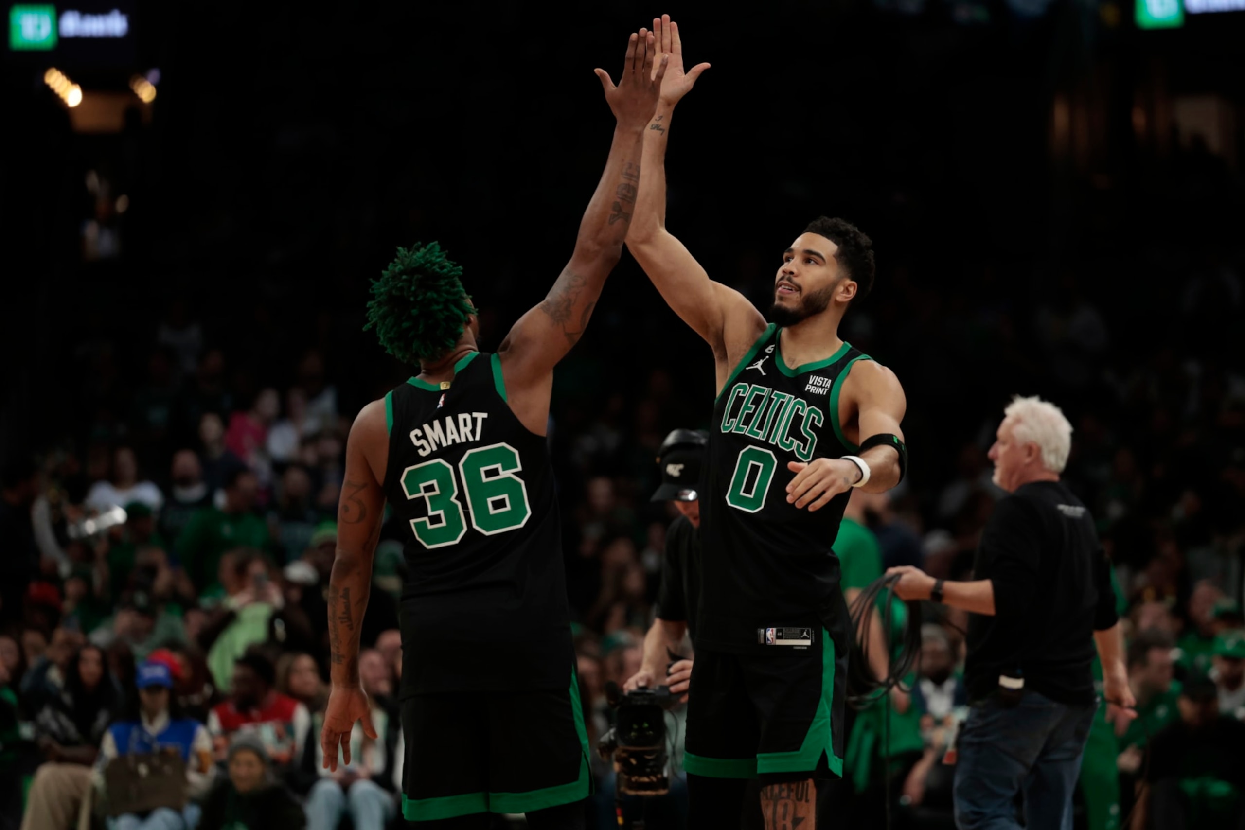 BOSTON, MASSACHUSETTS - DECEMBER 02: Jayson Tatum #0 of the Boston Celtics reacts with Marcus Smart #36 of the Boston Celtics prior to the start of the game between the Celtics and the Heat at TD Garden on December 02, 2022 in Boston, Massachusetts. NOTE TO USER: User expressly acknowledges and agrees that, by downloading and or using this photograph, User is consenting to the terms and conditions of the Getty Images License Agreement. (Photo by Nick Grace/Getty Images)