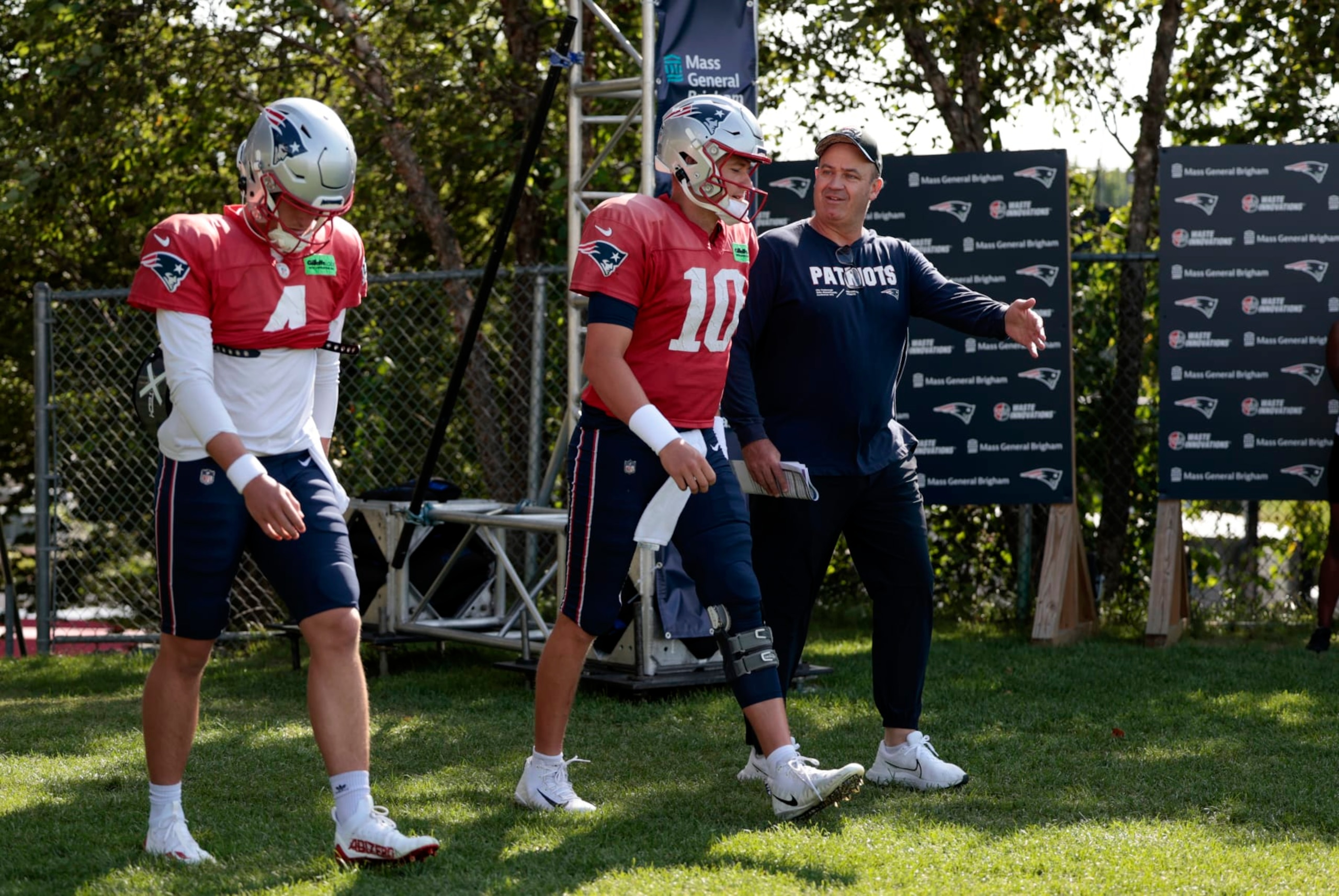 Bailey Zappe (left), Mac Jones and Bill O'Brien