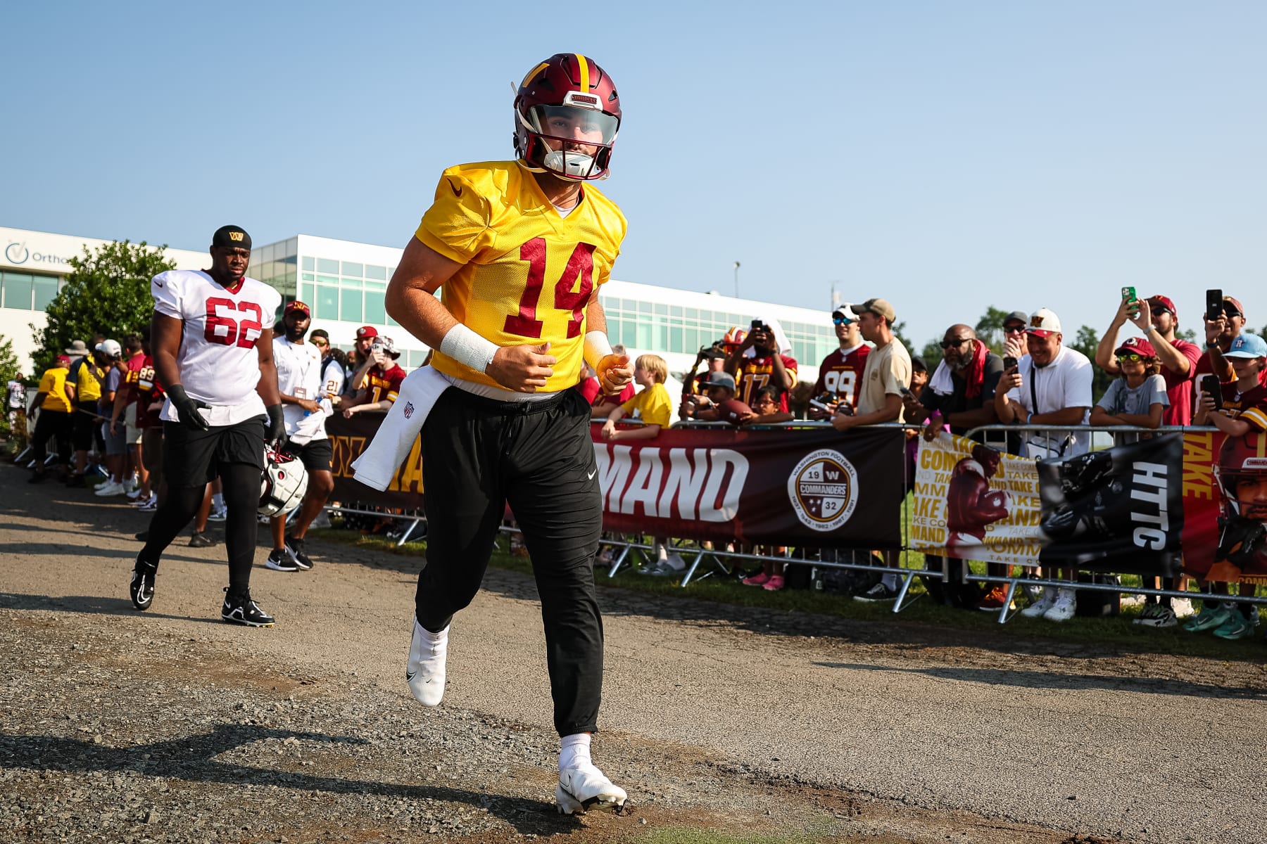 ASHBURN, VA - JULY 28: Sam Howell #14 of the Washington Commanders takes the field during training camp at OrthoVirginia Training Center on July 28, 2022 in Ashburn, Virginia. (Photo by Scott Taetsch/Getty Images)