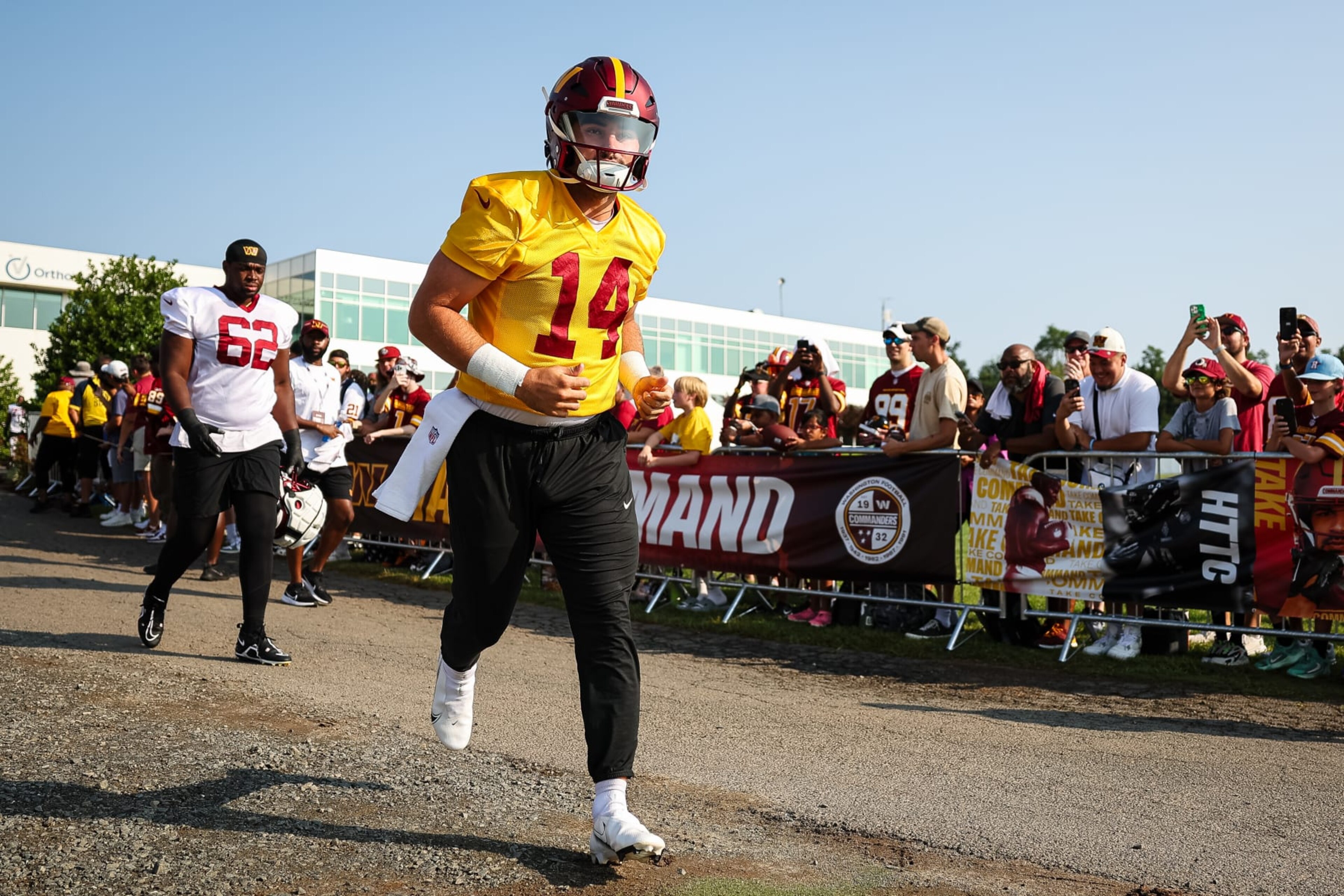ASHBURN, VA - JULY 28: Sam Howell #14 of the Washington Commanders takes the field during training camp at OrthoVirginia Training Center on July 28, 2022 in Ashburn, Virginia. (Photo by Scott Taetsch/Getty Images)