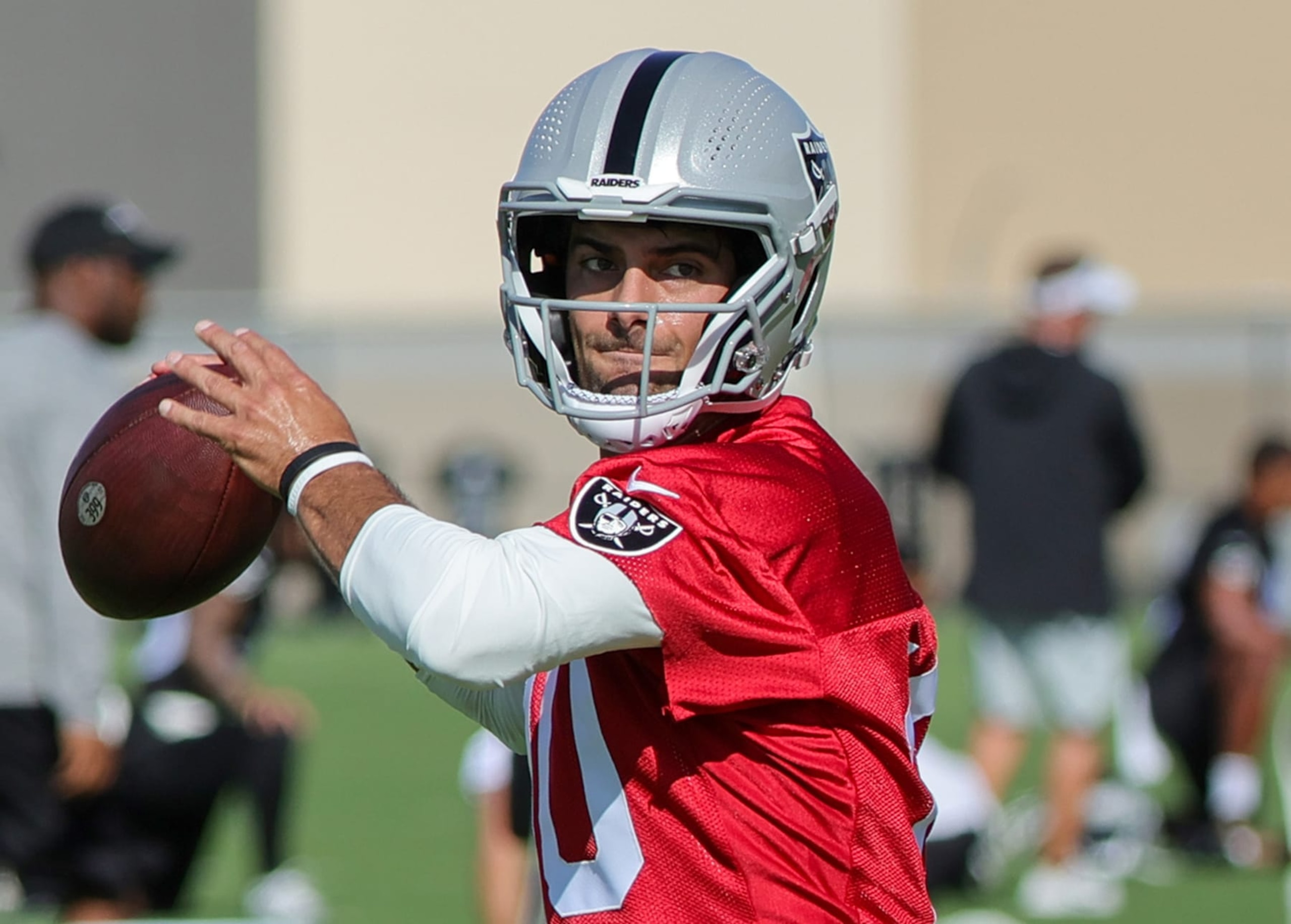 HENDERSON, NEVADA - JULY 26: Quarterback Jimmy Garoppolo #10 of the Las Vegas Raiders throws during the first practice of the team's training camp at the Las Vegas Raiders Headquarters/Intermountain Healthcare Performance Center on July 26, 2023 in Henderson, Nevada. (Photo by Ethan Miller/Getty Images)