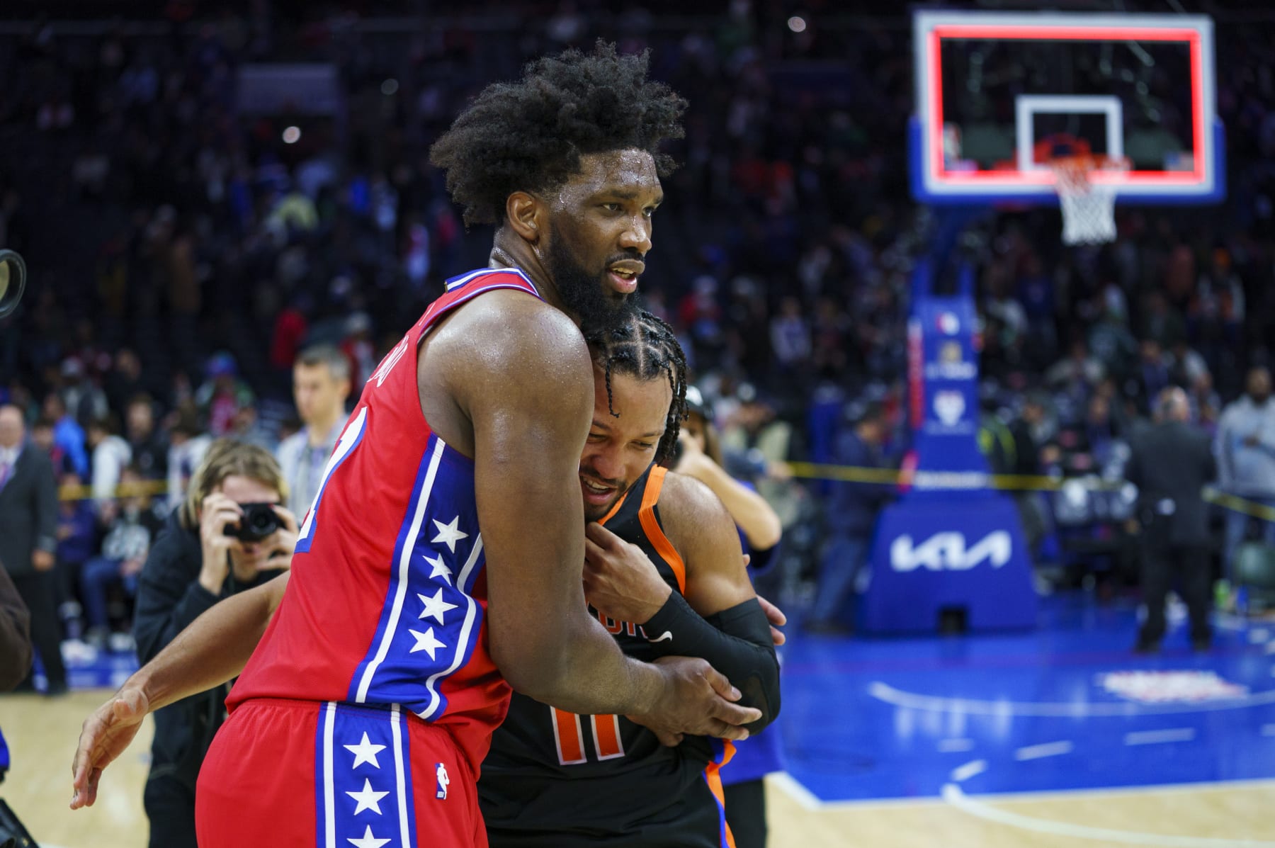 Philadelphia 76ers' Joel Embiid, left, talks with New York Knicks' Jalen Brunson, right. following the NBA basketball game, Friday, Feb. 10, 2023, in Philadelphia. The 76ers won 119-108. (AP Photo/Chris Szagola)