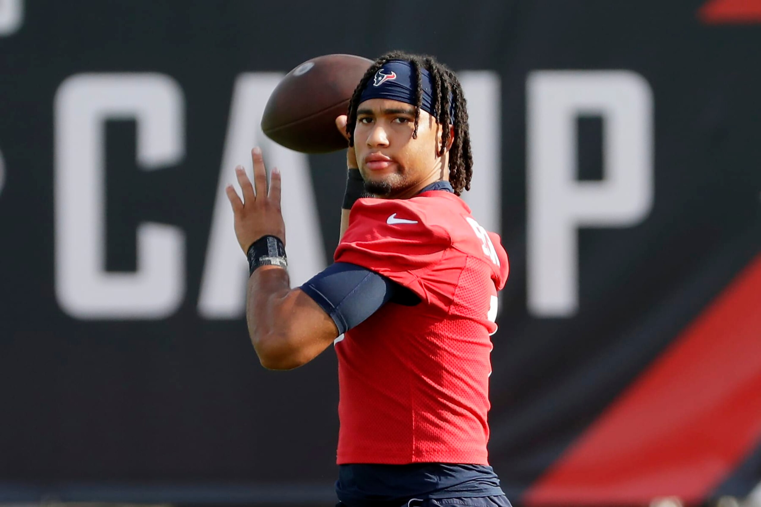 Houston Texans quarterback C.J. Stroud warms up during the NFL football team's training camp, Sunday, July 30, 2023, in Houston. (AP Photo/Michael Wyke)