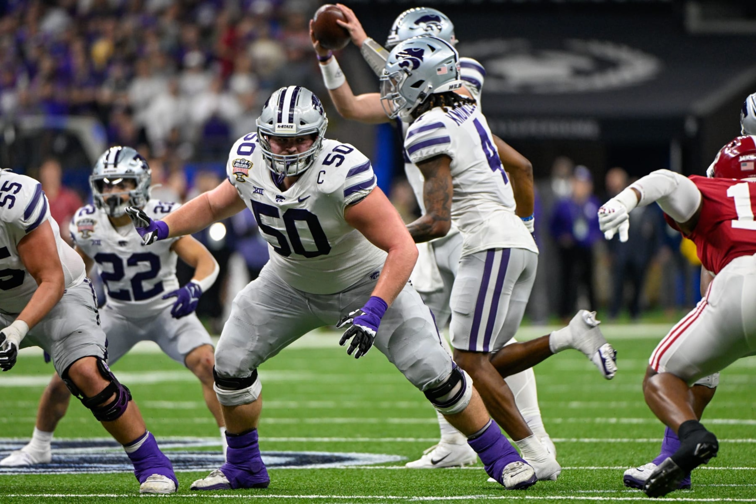 NEW ORLEANS, LA - DECEMBER 31: Kansas State Wildcats offensive lineman Cooper Beebe (50) prepares to block during the Sugar Bowl between the Alabama Crimson Tide and Kansas State Wildcats at Caesars Superdome on December 31, 2022 in New Orleans, LA. (Photo by Ken Murray/Icon Sportswire via Getty Images)