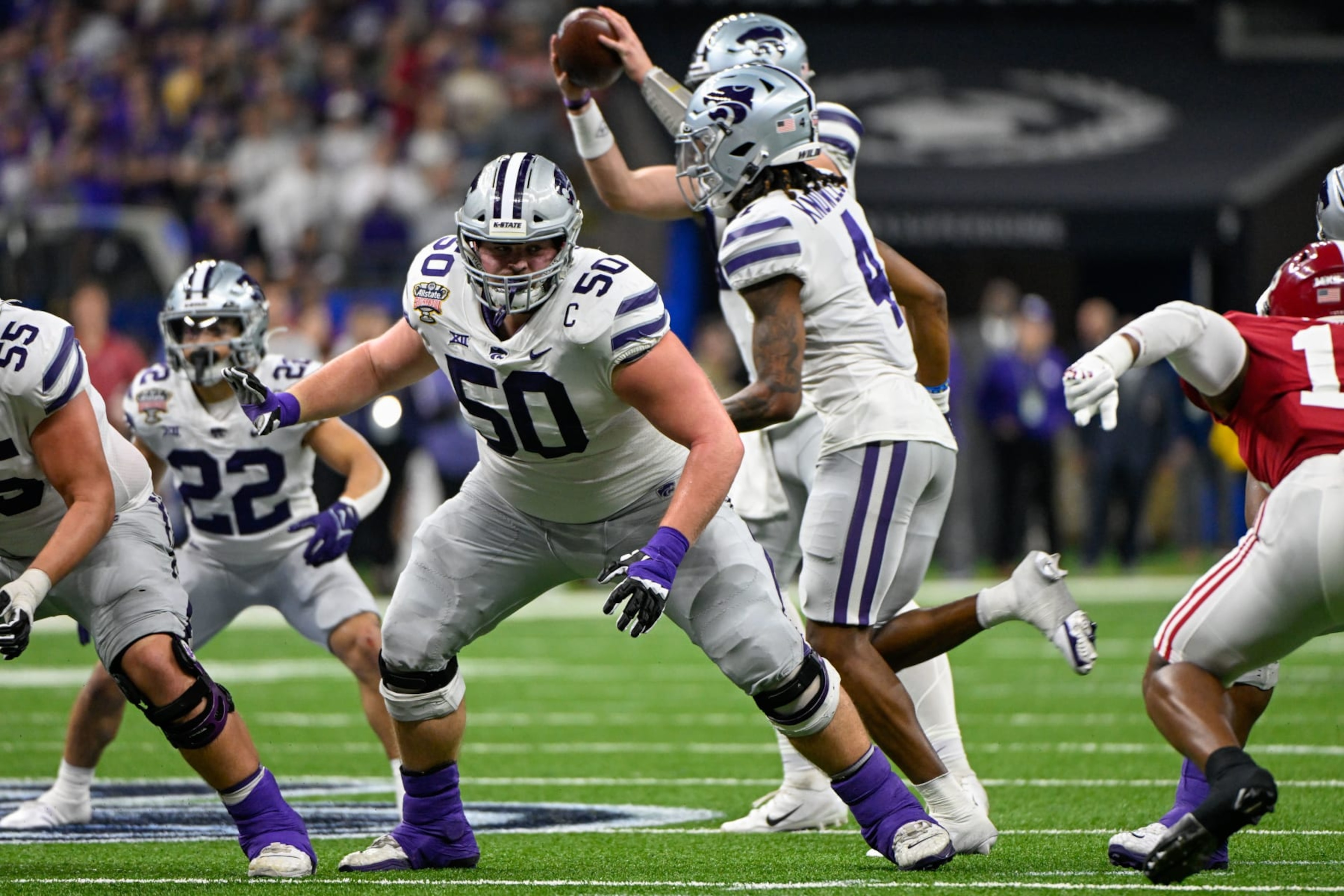 NEW ORLEANS, LA - DECEMBER 31: Kansas State Wildcats offensive lineman Cooper Beebe (50) prepares to block during the Sugar Bowl between the Alabama Crimson Tide and Kansas State Wildcats at Caesars Superdome on December 31, 2022 in New Orleans, LA. (Photo by Ken Murray/Icon Sportswire via Getty Images) NEW ORLEANS, LA - DECEMBER 31: Kansas State Wildcats offensive lineman Cooper Beebe (50) prepares to block during the Sugar Bowl between the Alabama Crimson Tide and Kansas State Wildcats at Caesars Superdome on December 31, 2022 in New Orleans, LA. (Photo by Ken Murray/Icon Sportswire via Getty Images)